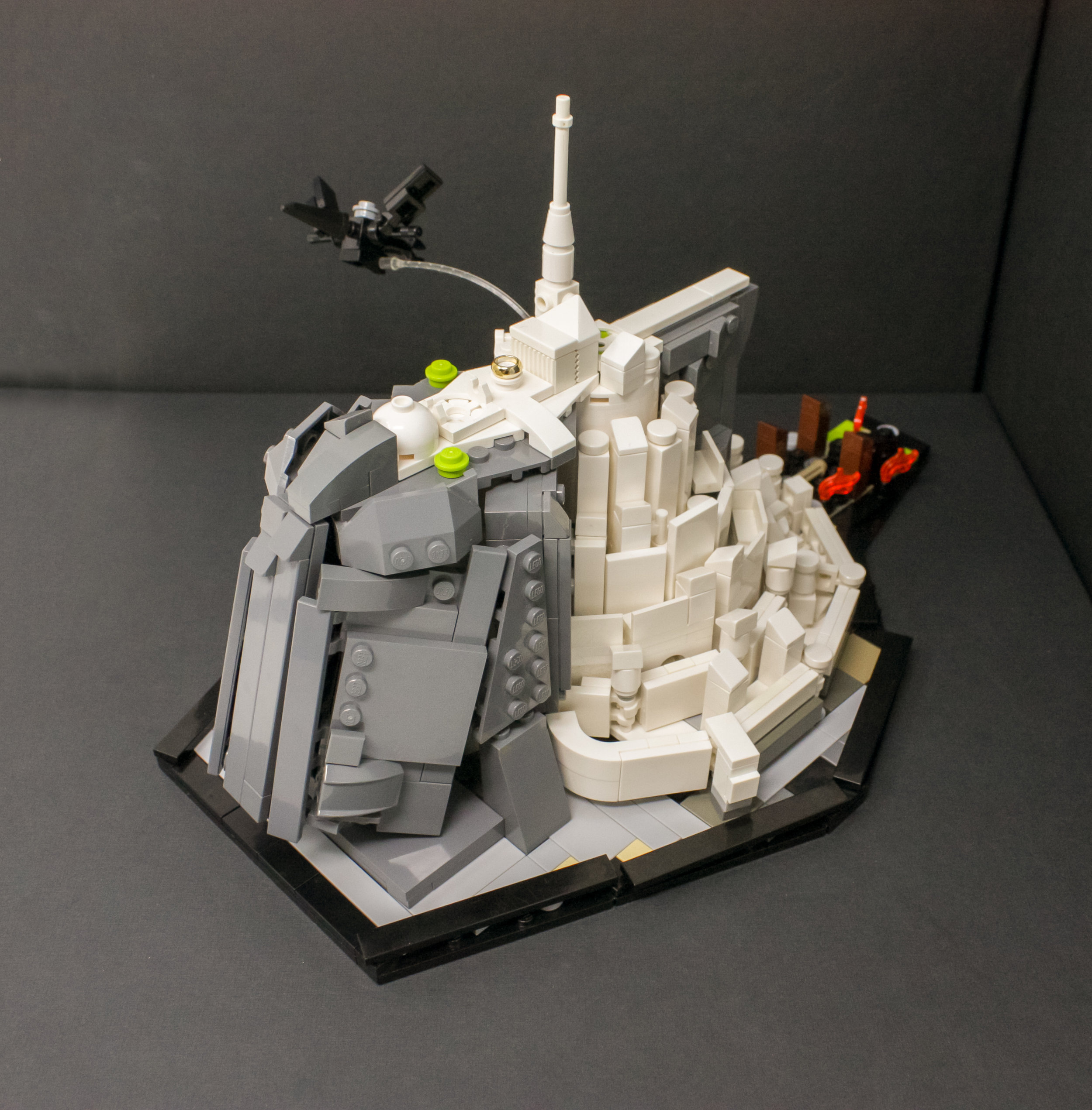 The movie model, the collector's edition model and paintings all vary on what exactly is built on the mountain top, so I took some creative liberties with a spare One Ring piece I had lying around.