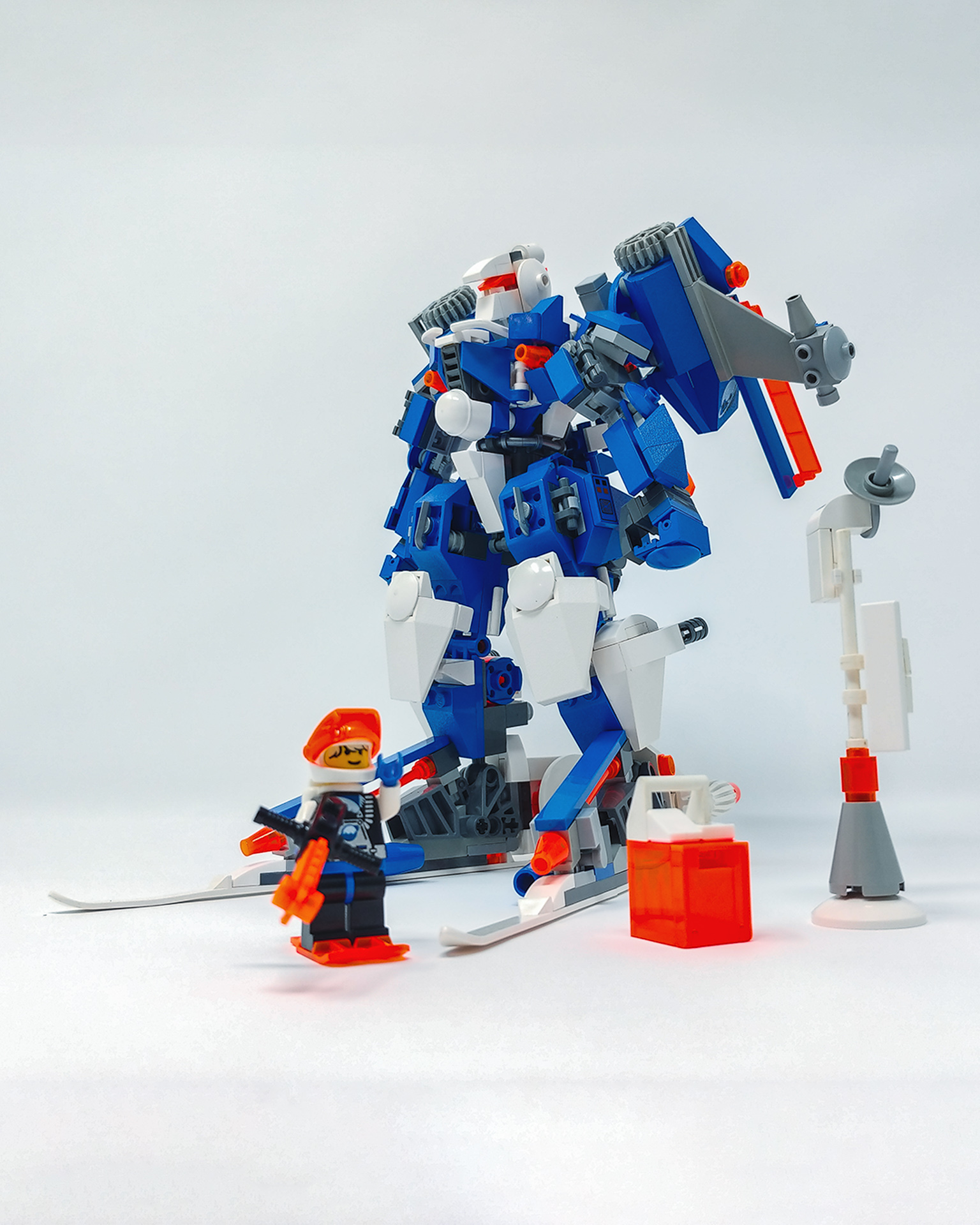 A minifigure for scale. Details on the robot include hockey sticks for a chest protector, a Snow Trooper helmet for a cockpit, and even ice skates for leg protection.