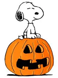 Snoopy sitting on scared pumpkin.jpeg
