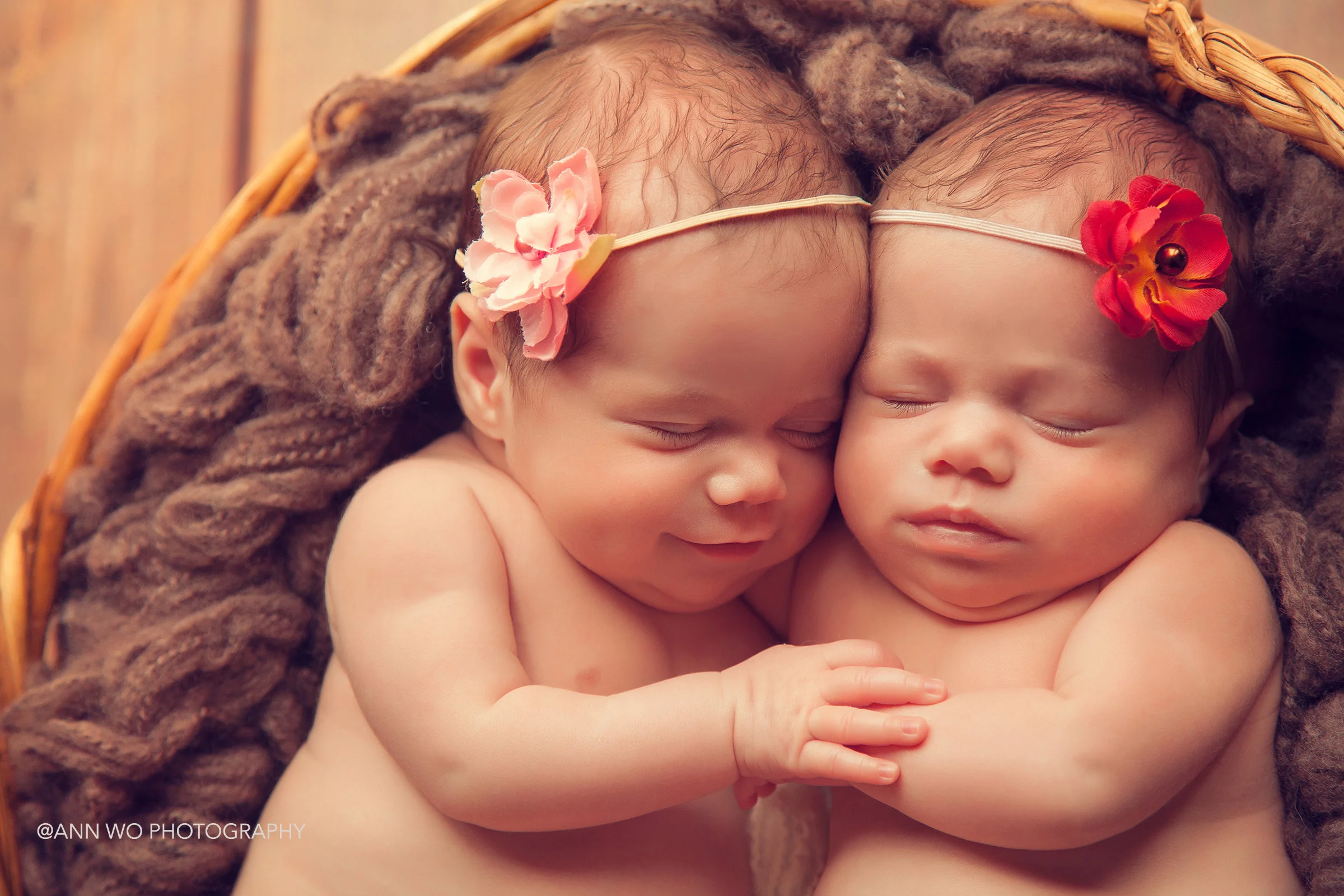 smiling newborn twins hugging - ann wo photography in London