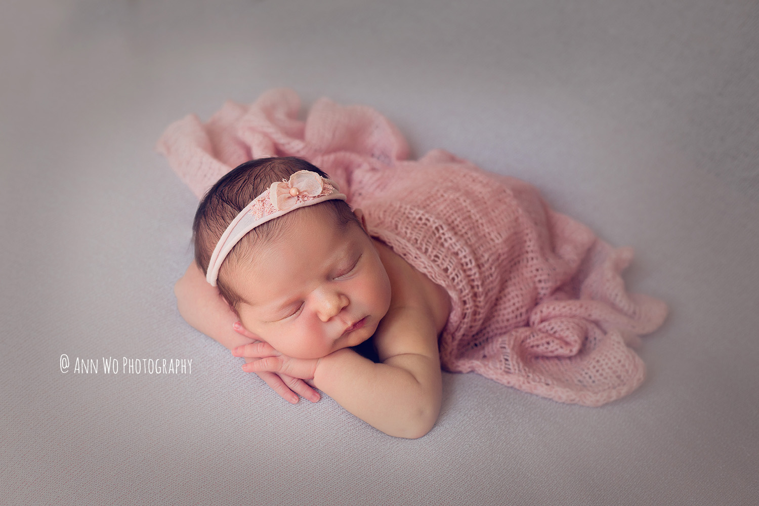 newborn photography in London by Ann Wo grey and pink headband