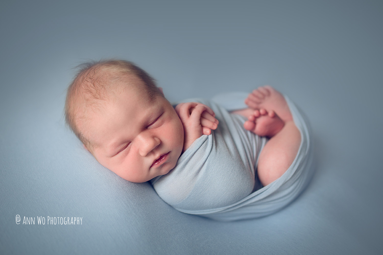 Blue wrap newborn baby photography London UK 