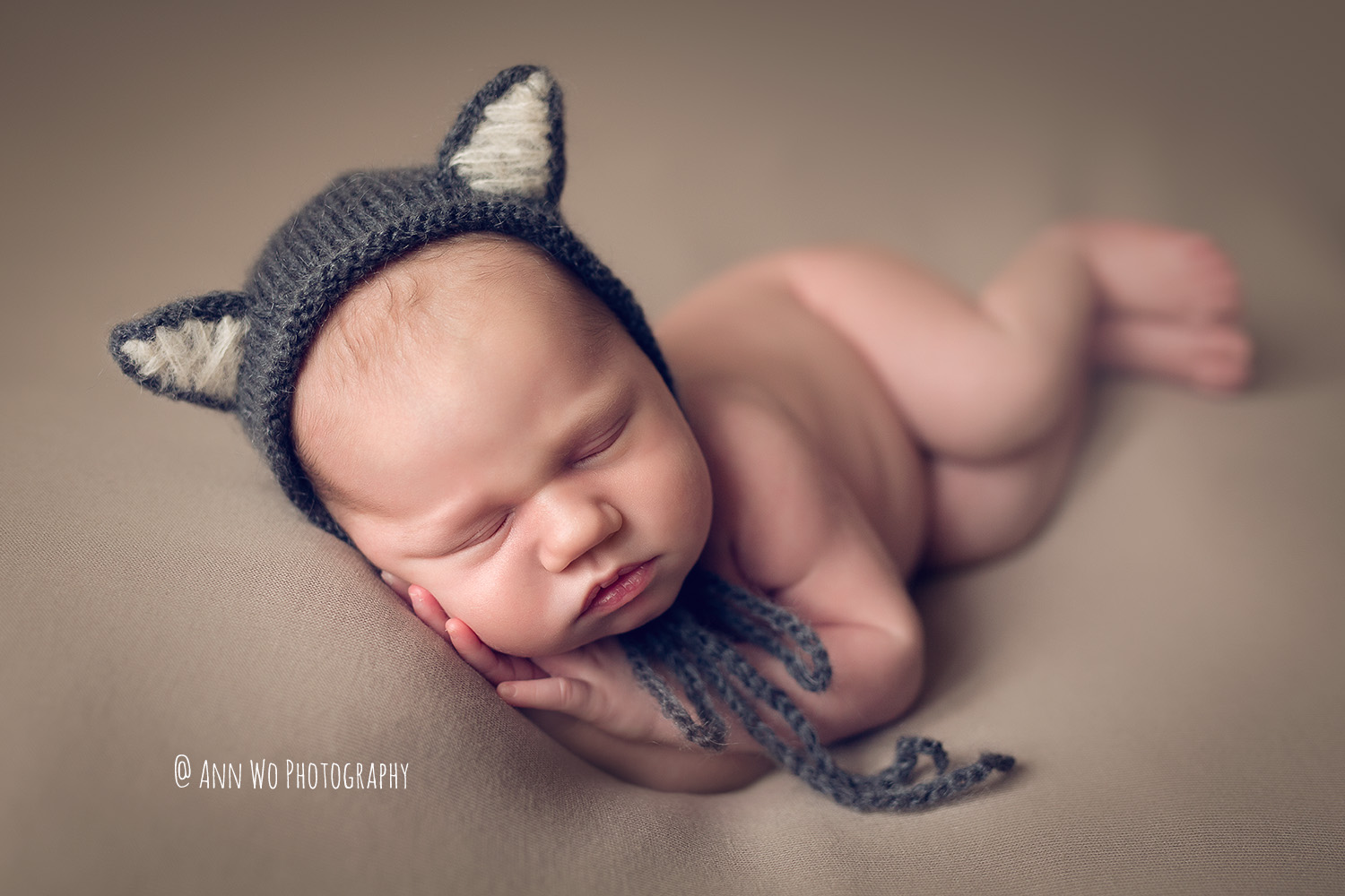 Newborn photographer Ann Wo in Scotland - wolf hat taupe fabric backdrop 