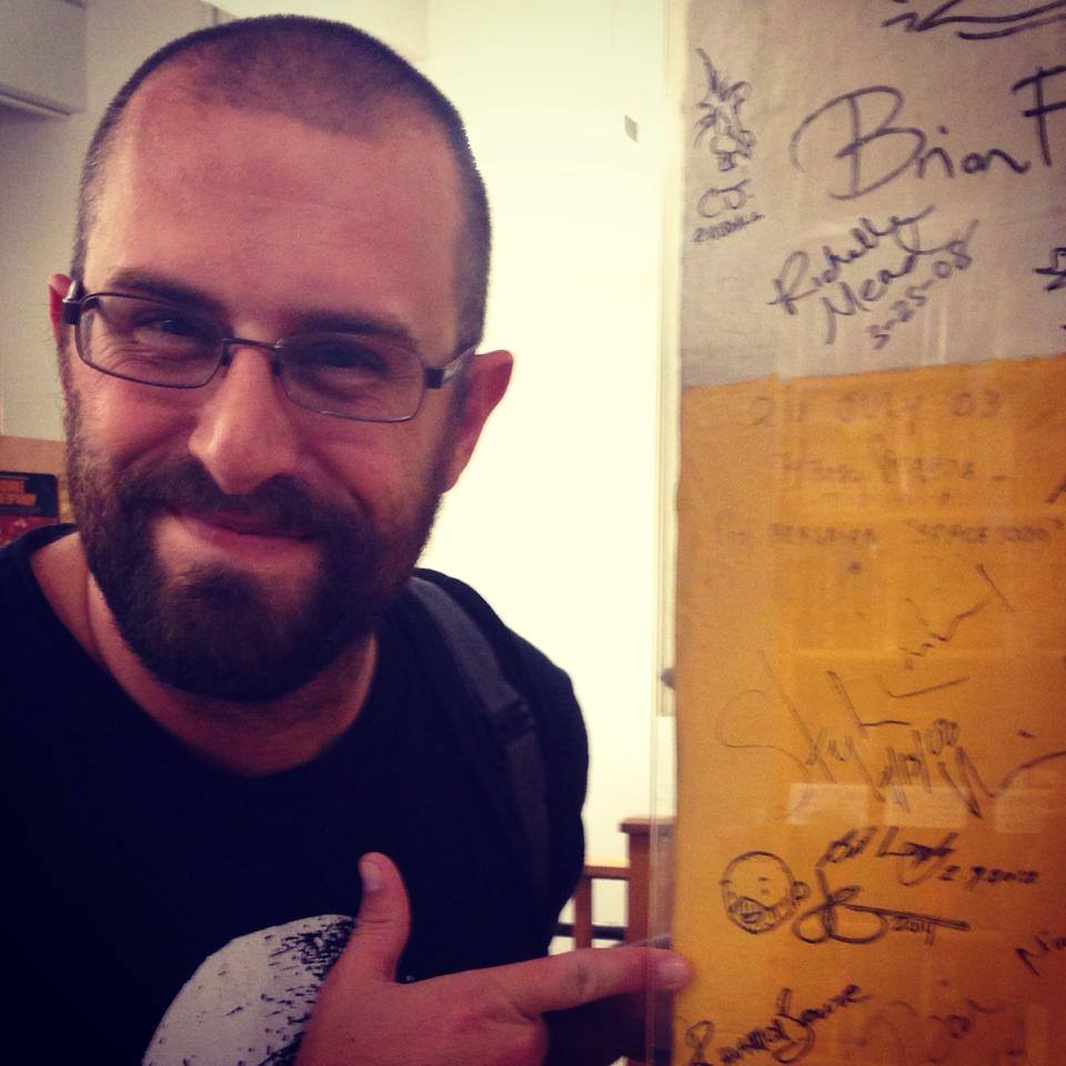Hanging out on the same author wall that Neil Gaiman and others have signed. "You're a part of history now," the bookseller told me. 