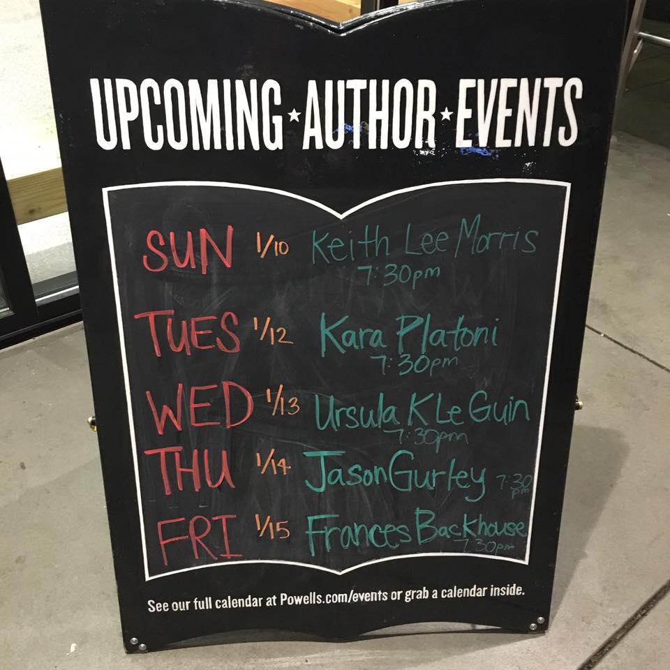 Signboard of author events outside the entrance to Powell's.