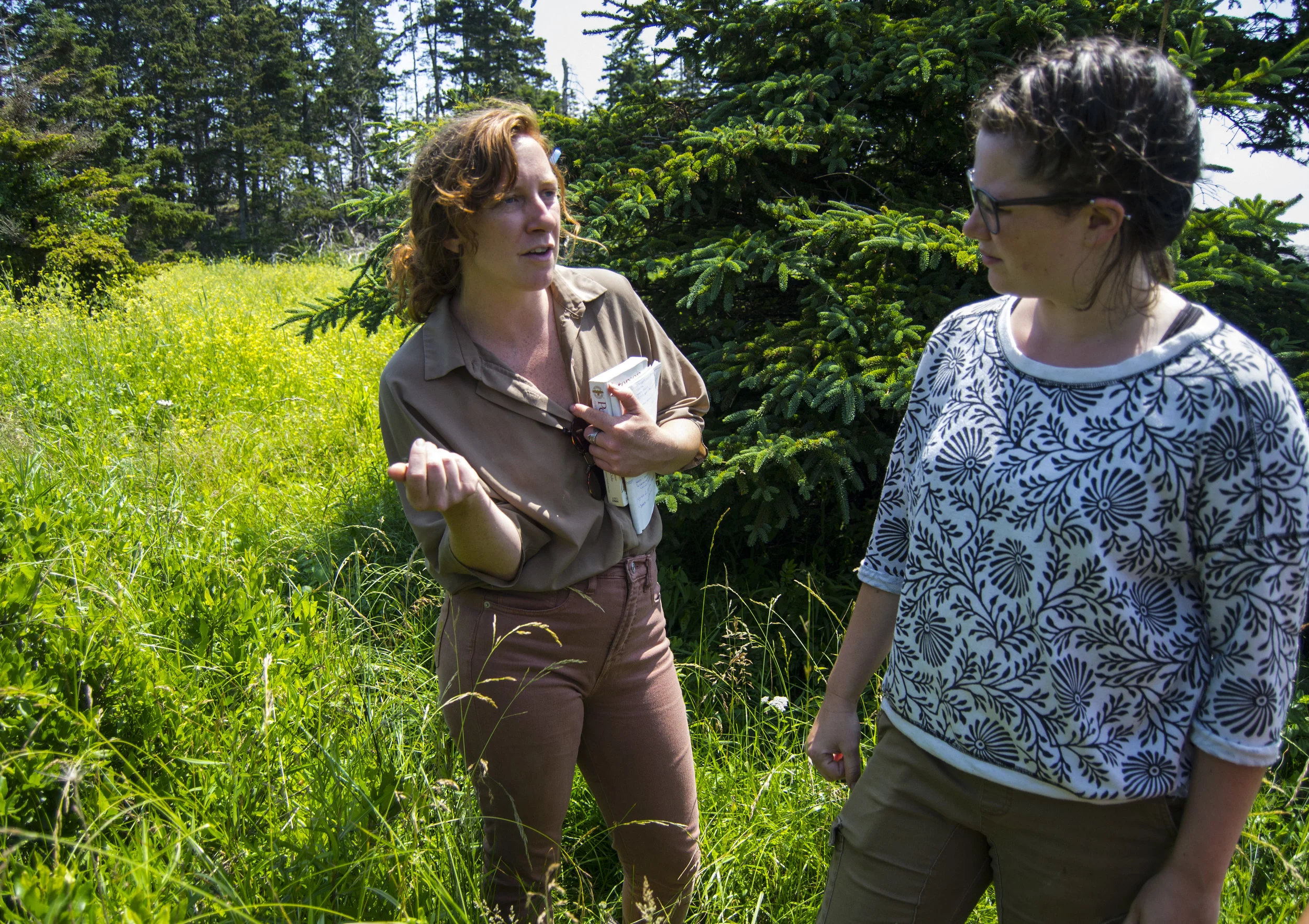 Mackenzie (right) learning about the medicinal plants found in the HLC forest from herbalist-in-training, Erica Fraser (left).