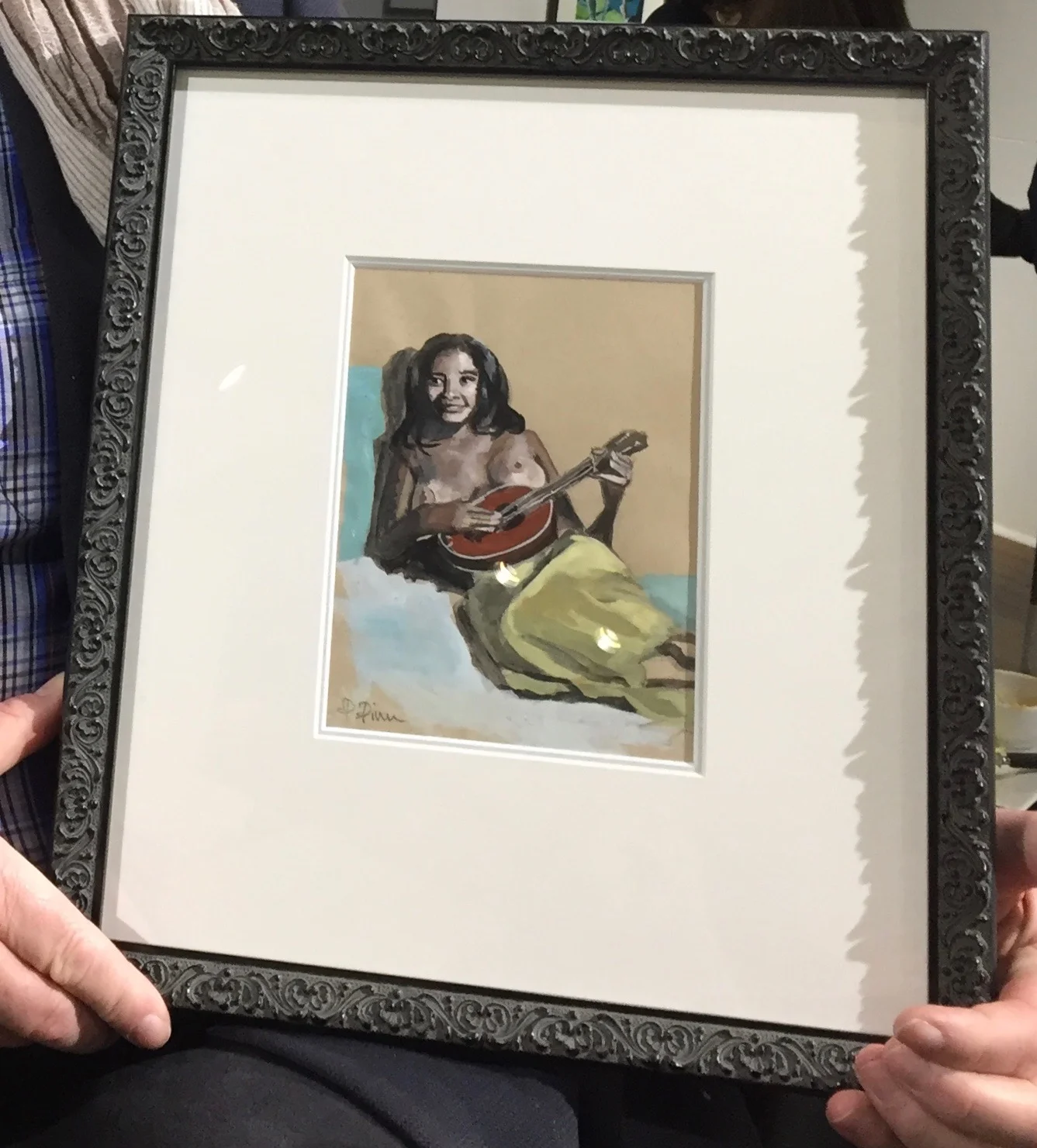 Emilia with ukulele framed with buyer