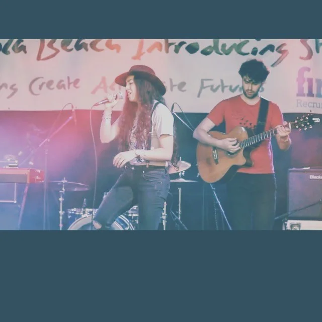 emel singing Riv fest polaroid pic.jpg