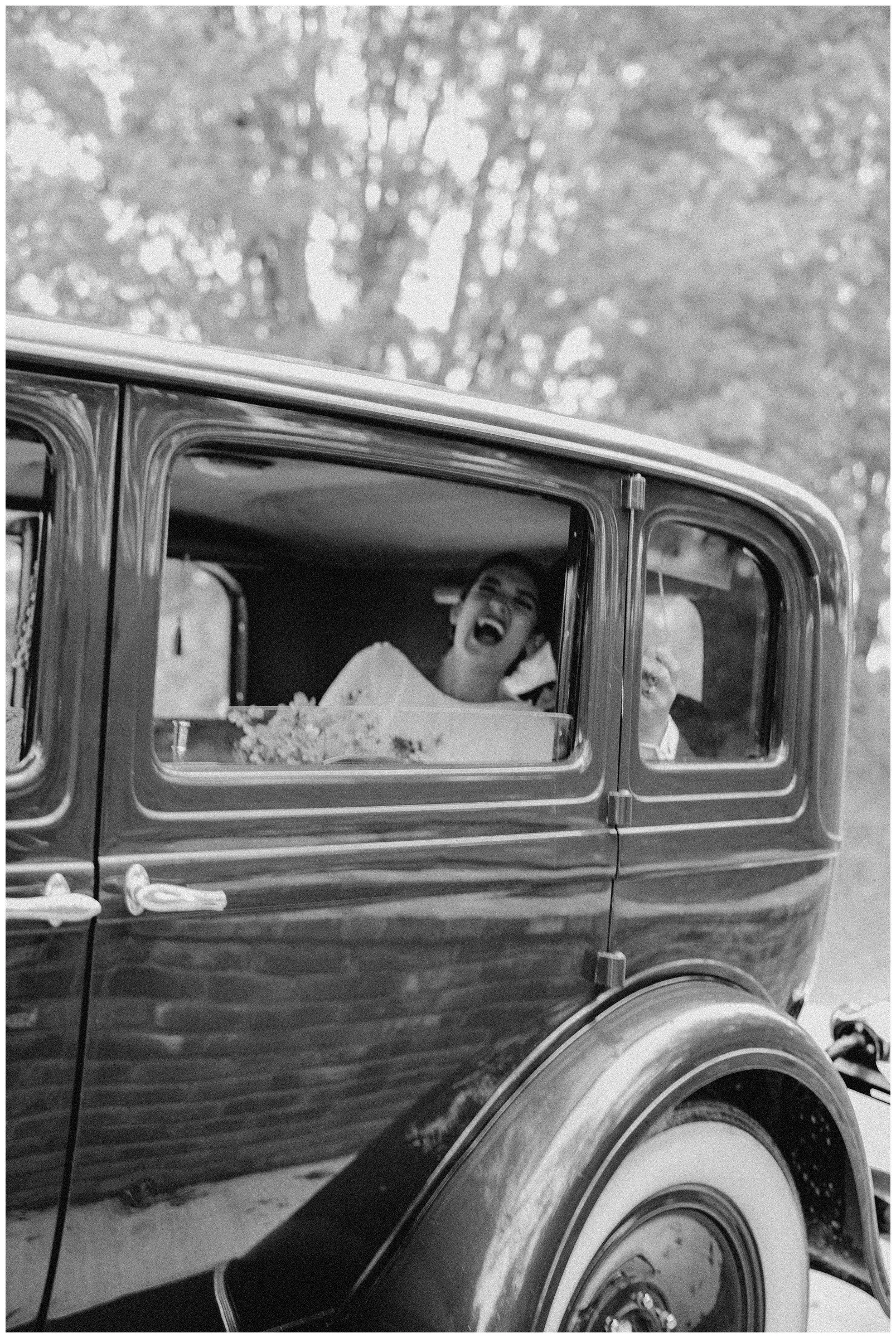 bride-laughing-in-getaway-car-wildcliff-weddings-events.JPG