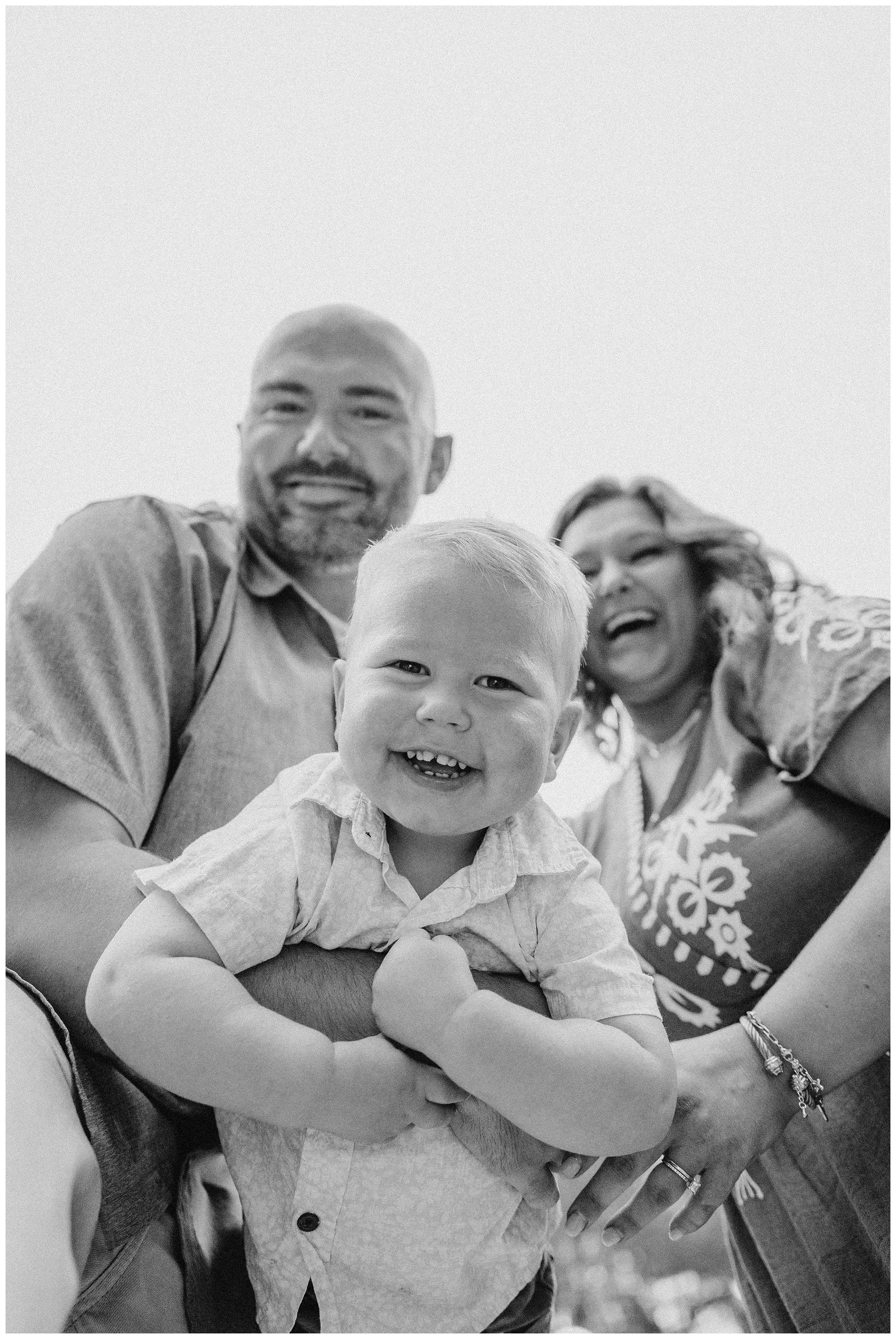 giggly-toddler-with-parents.jpg