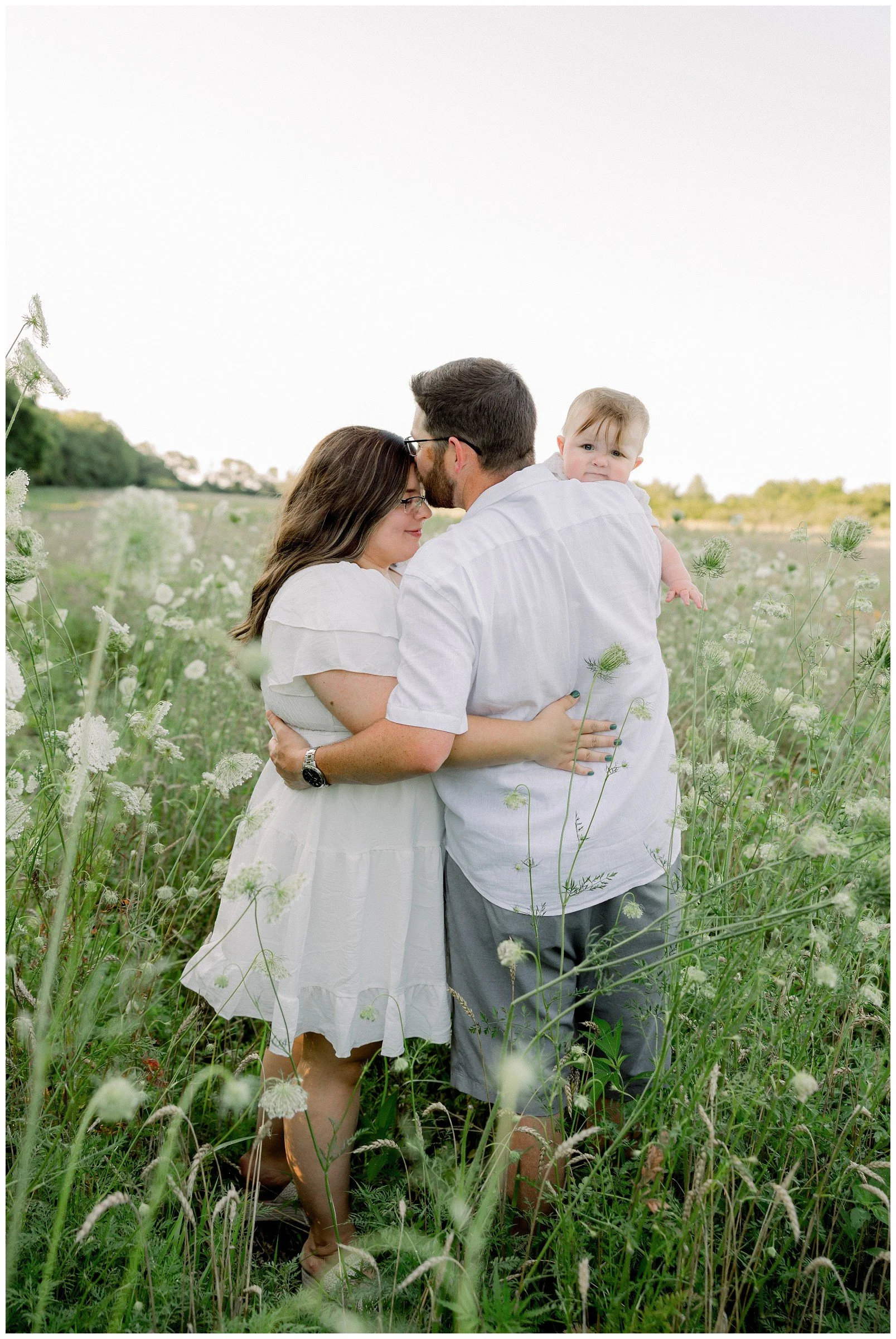 parents-with-baby-flower-field.jpg