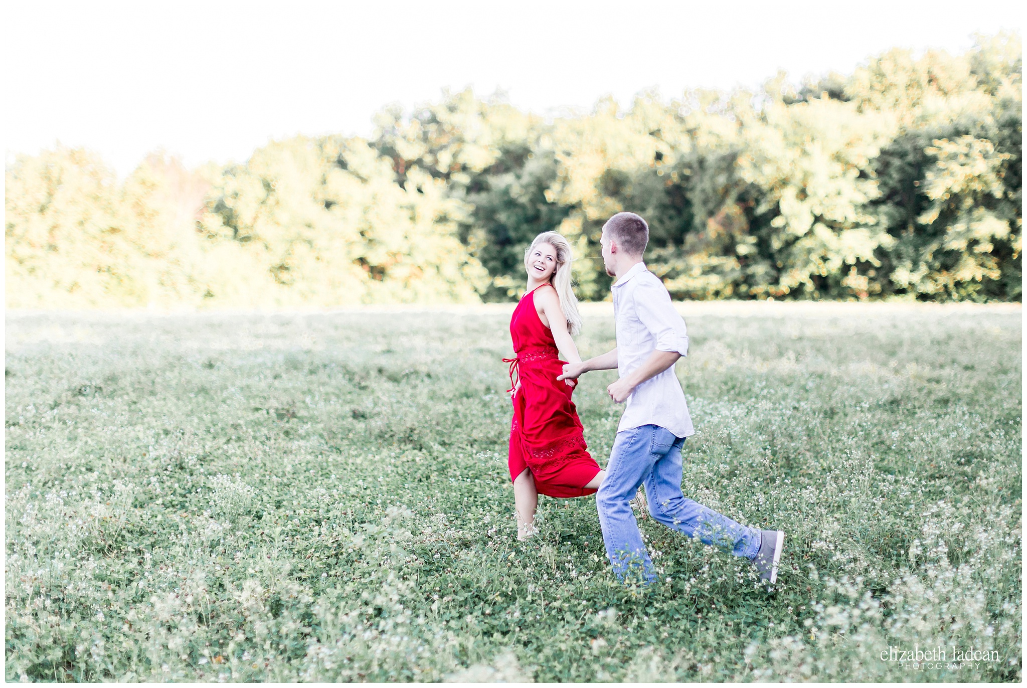 Running through a field of flowers engagement session