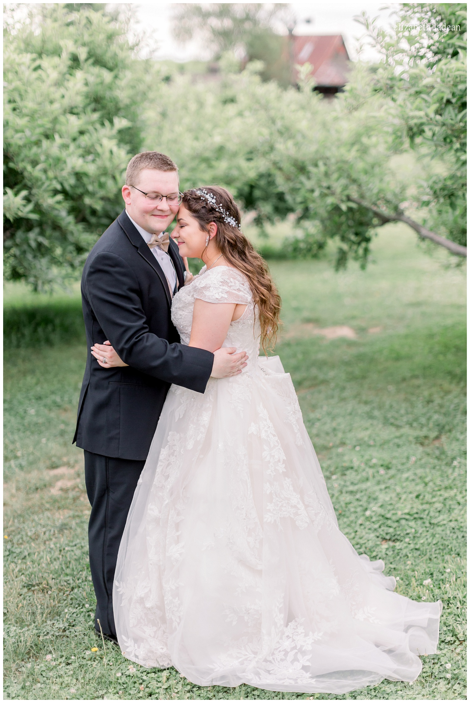  bride and groom portraits in apple orchard at weston red barn farm 