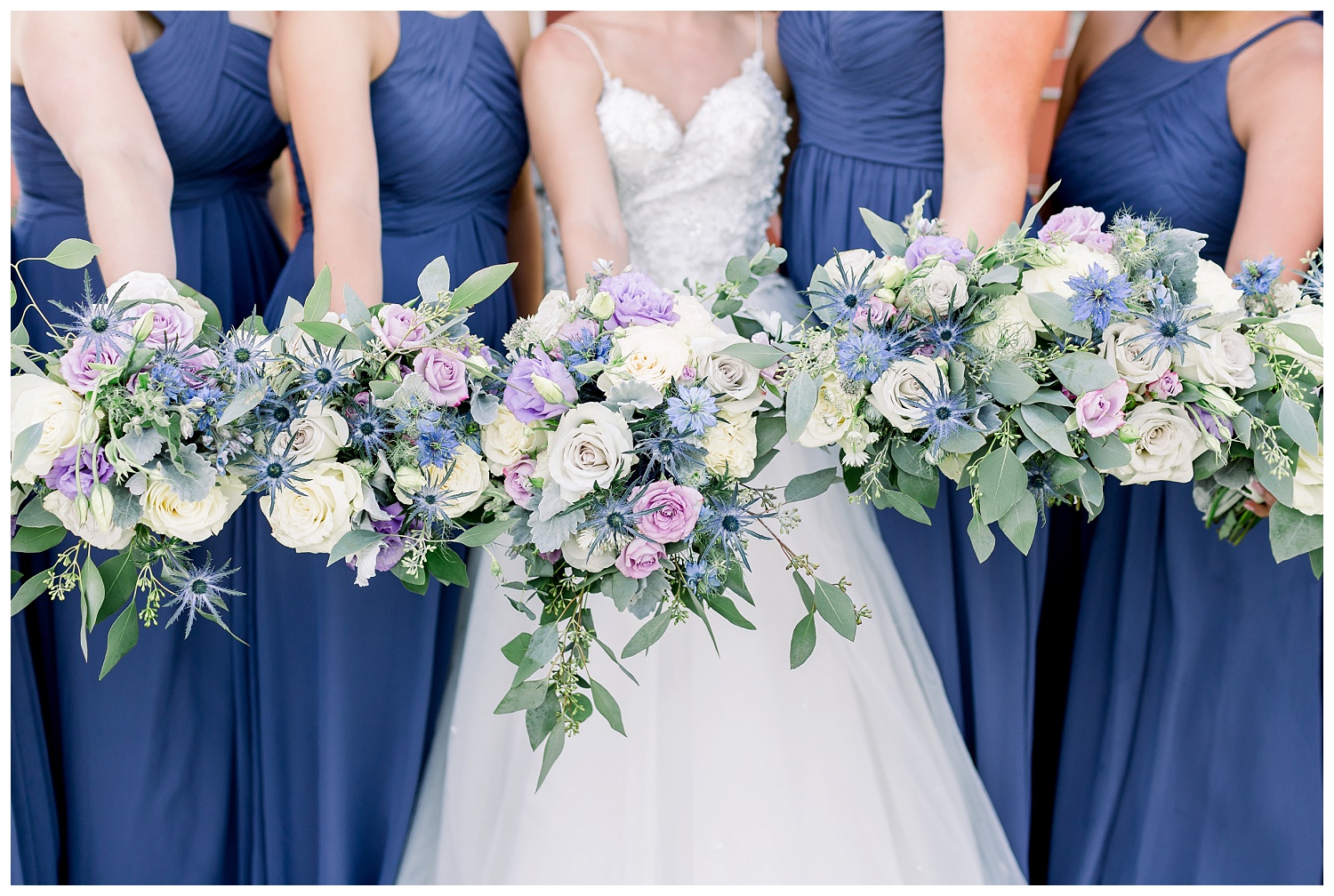 Purple bridesmaid dresses and bouquets