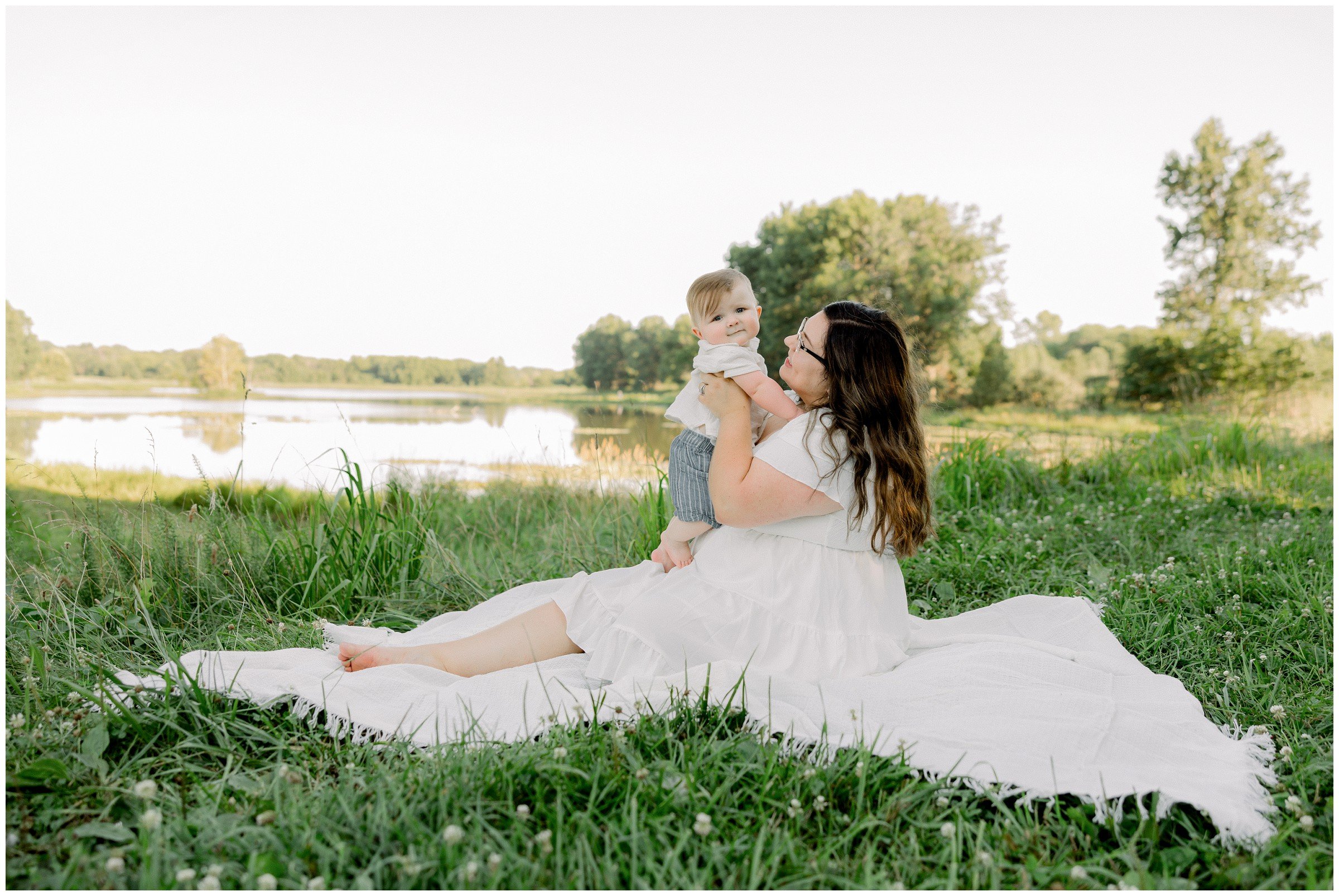 mom-with-toddler-on-blanket-green-grass.jpg