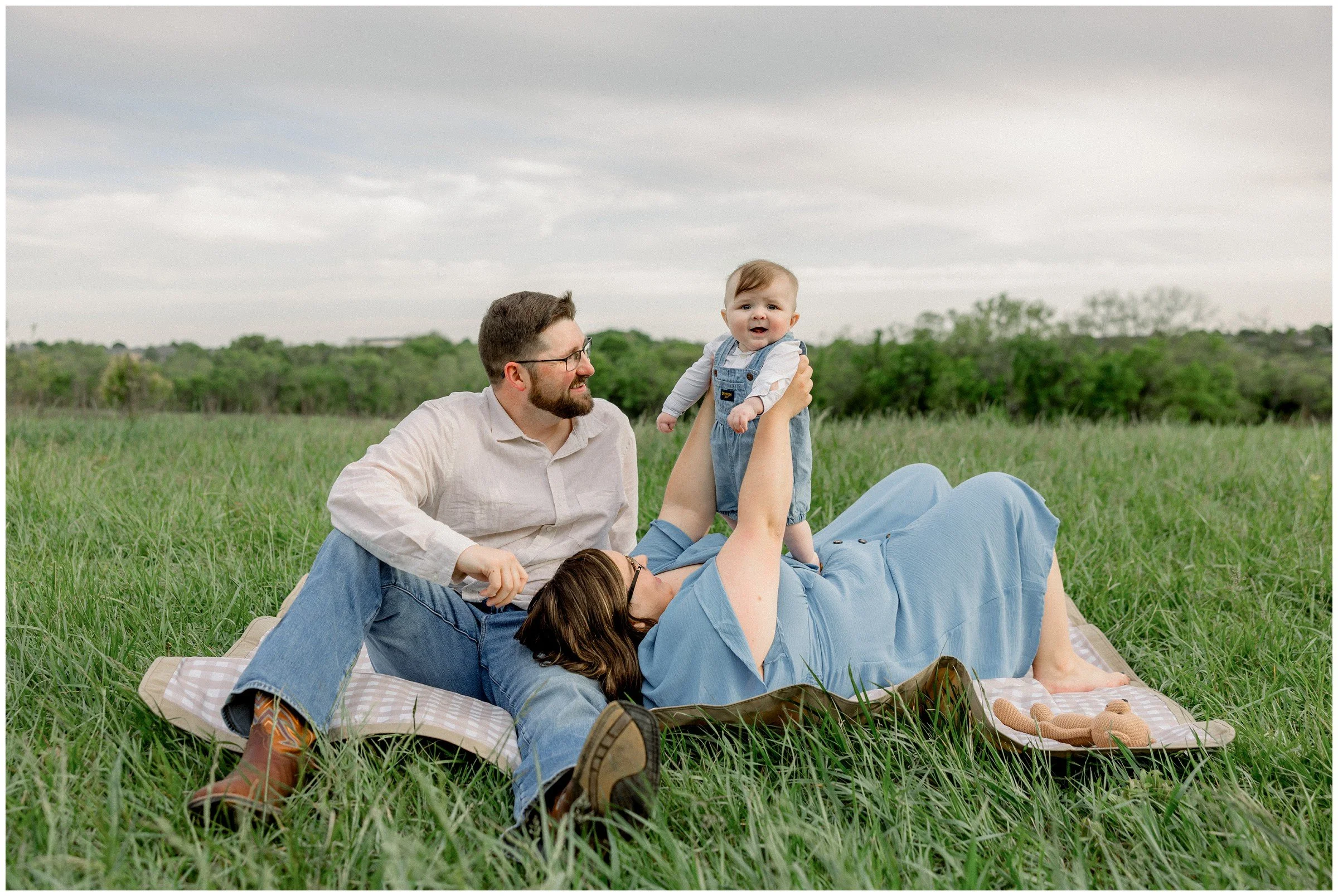 parents-with-baby-on-blanket.jpg