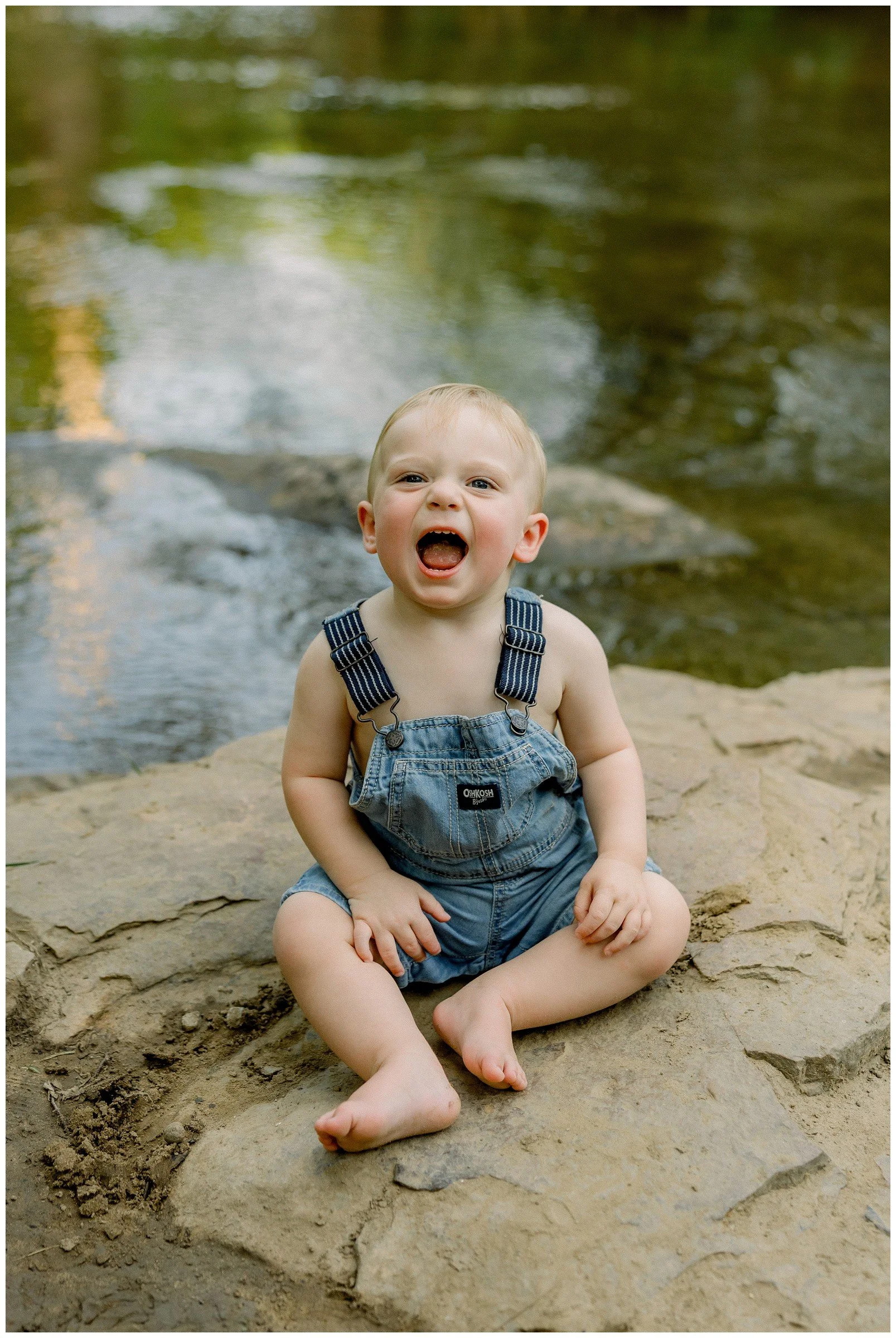 toddler-boy-in-overalls-at-creek.jpg