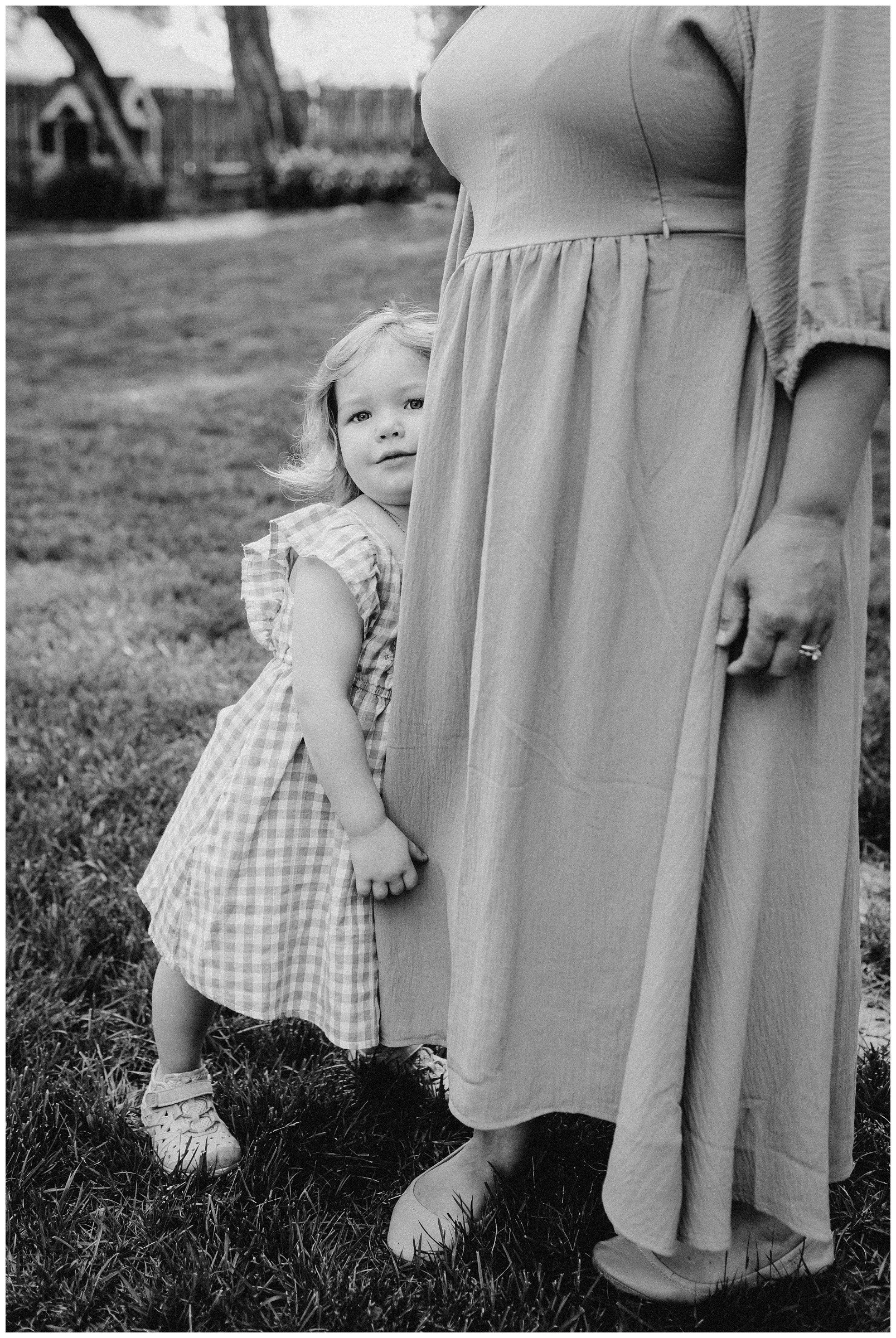 little-girl-hiding-in-mom-dress.jpg