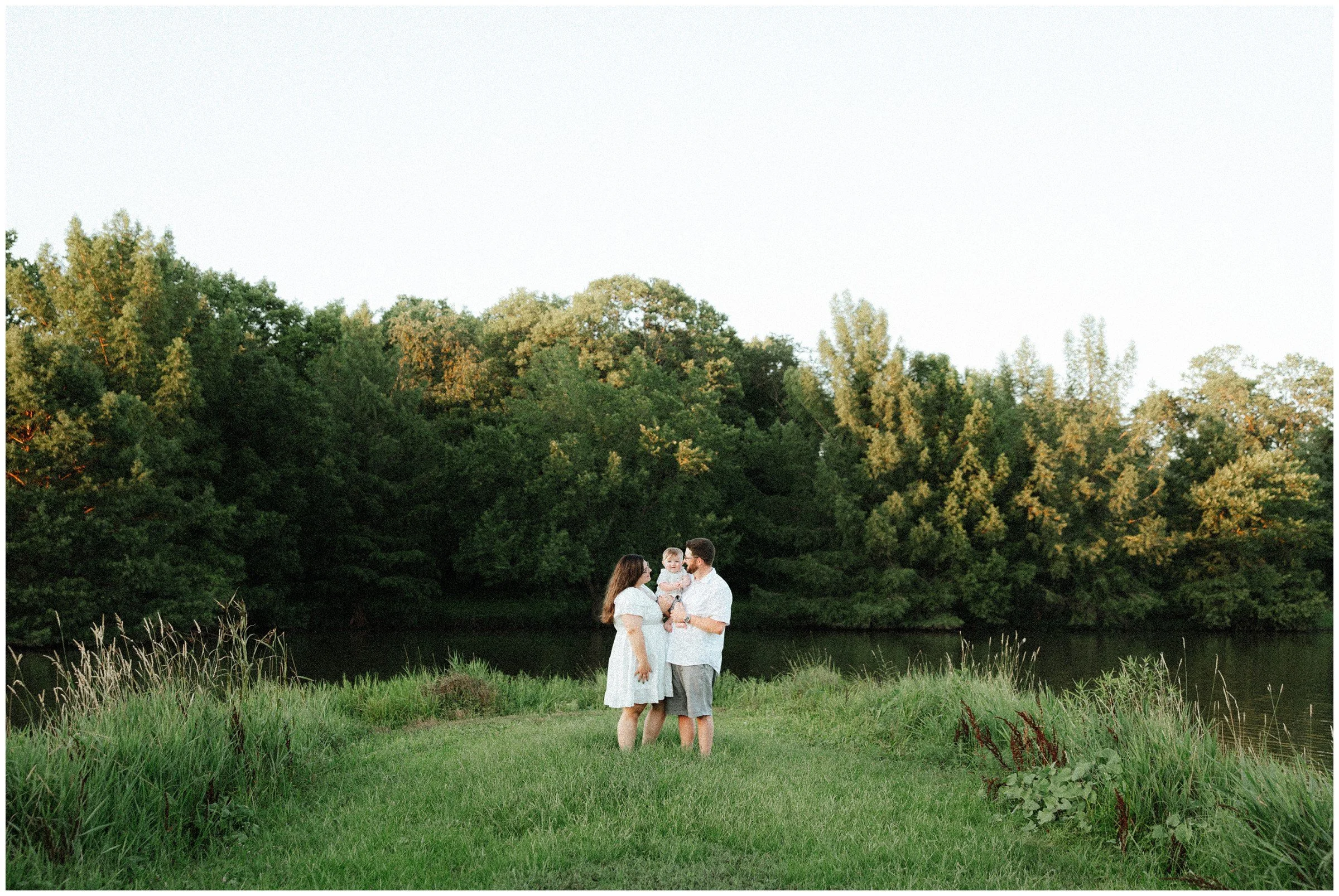 parents-with-baby-by-lake.jpg