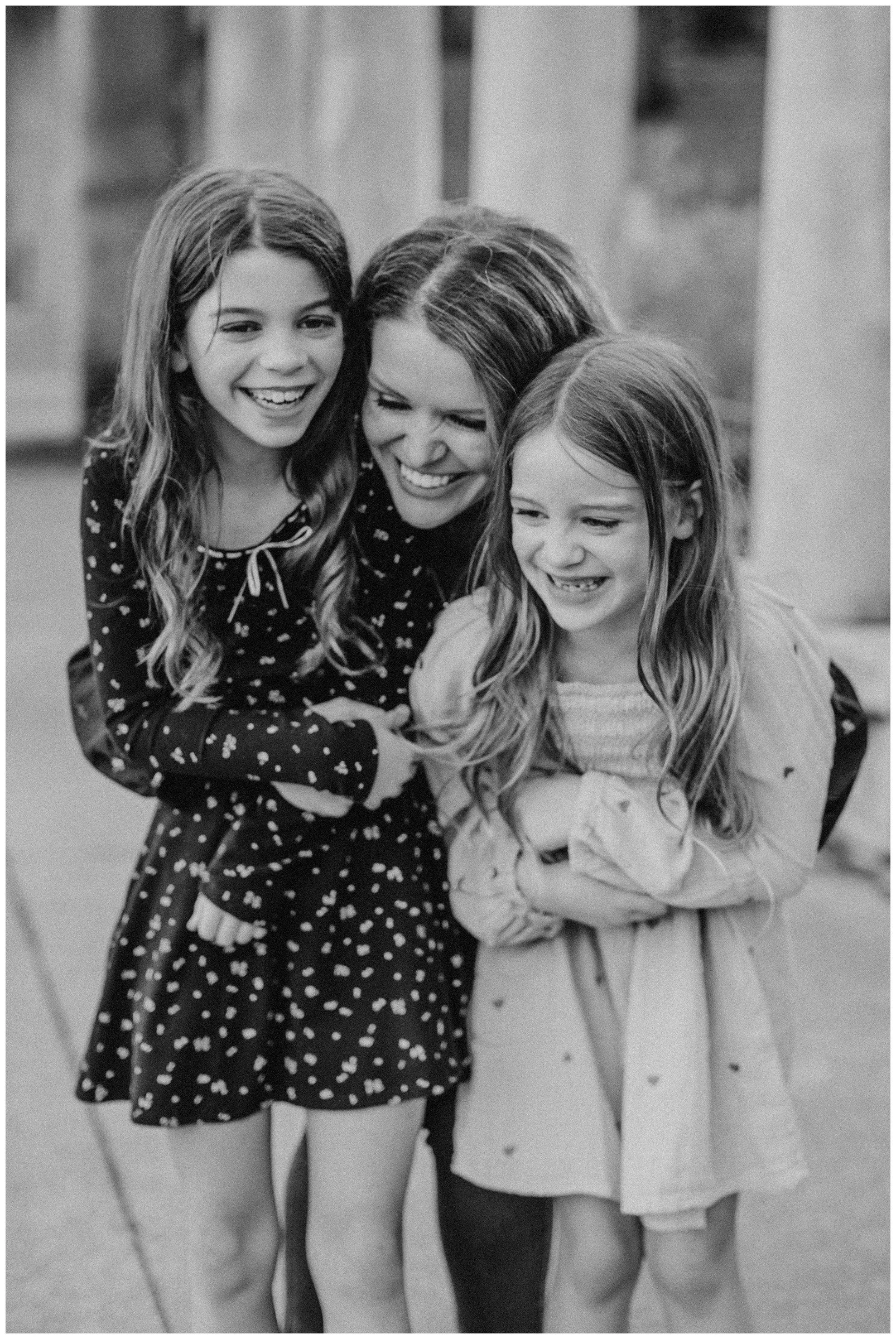 mom-hugging-two-daughters.jpg