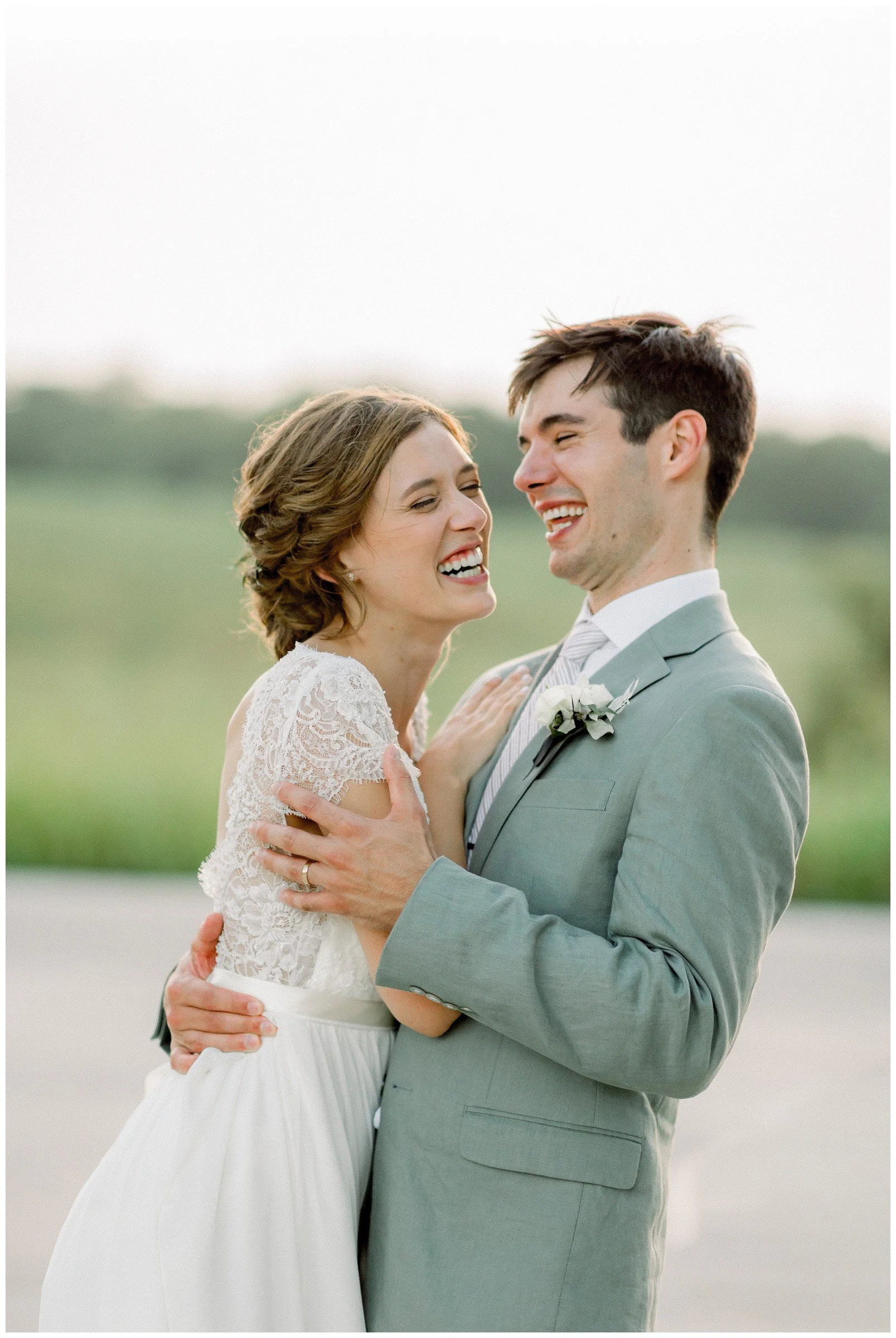 laughing-embracing-bride-groom.JPG