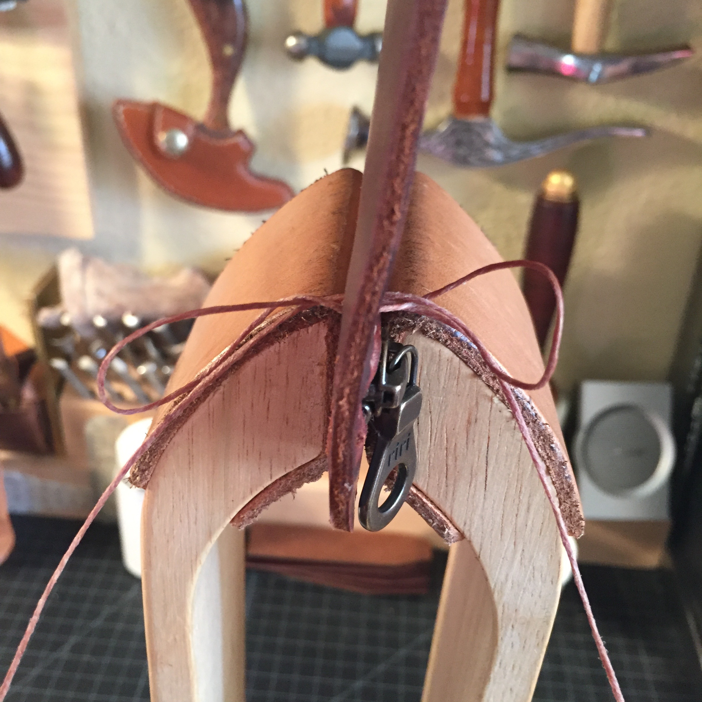 Pull the thread tight. 