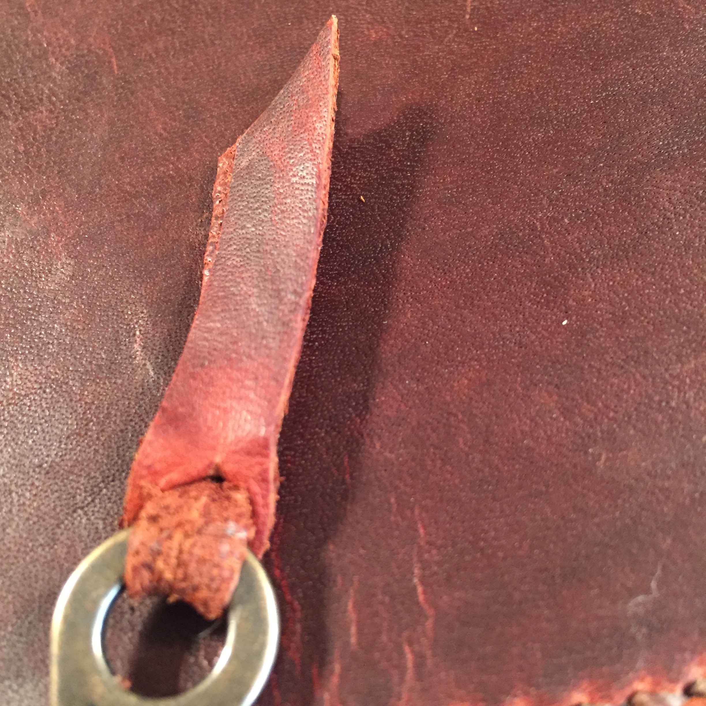 The piece that was cut away can be used to make a little pull tab for the zipper pull. 