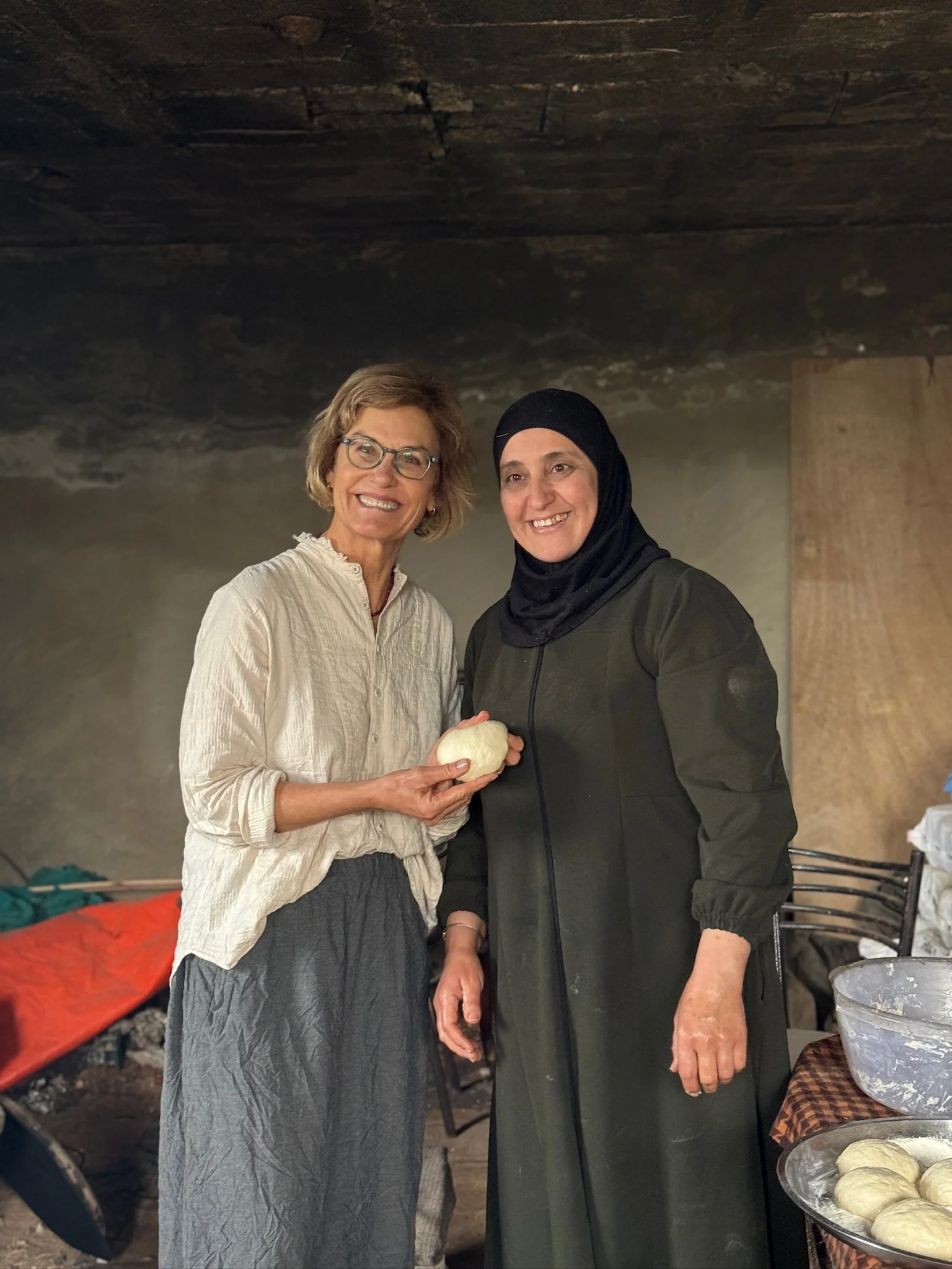 Reema has been making Taboon bread since she was a young girl. The dough was already mixed, waiting to be shaped into soft, delicate balls. I tried to follow her hands—fingers gently curving inward—but what she made look effortless, carrying years of