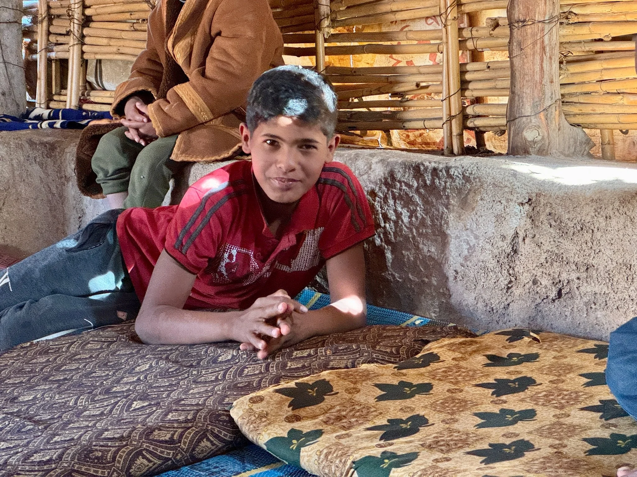 First greeted by Abjulah, 13 years old, who became our defacto host. Full of personality he called himself, ‘King of Jordan.’ We were absolutely enamoured by him. 
