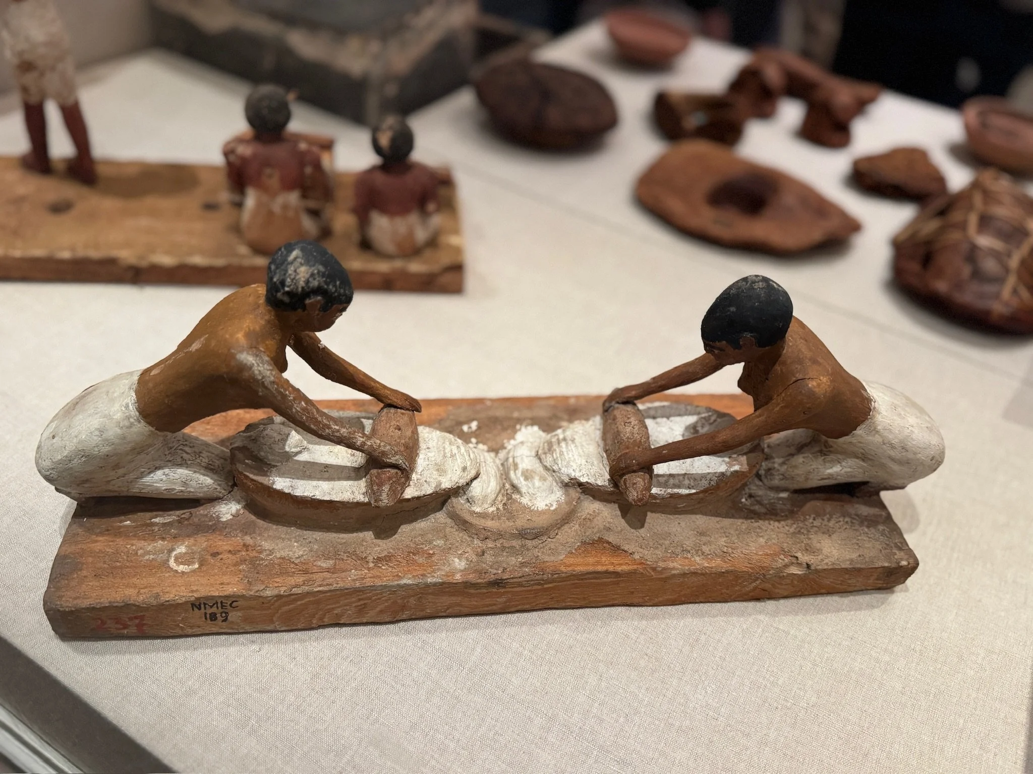 Women ground grain by hand, kneeling over mill stones. Dough was mixed simply—flour, water, salt—rarely yeast. Loaves were baked directly on fire or in clay molds inside ovens.