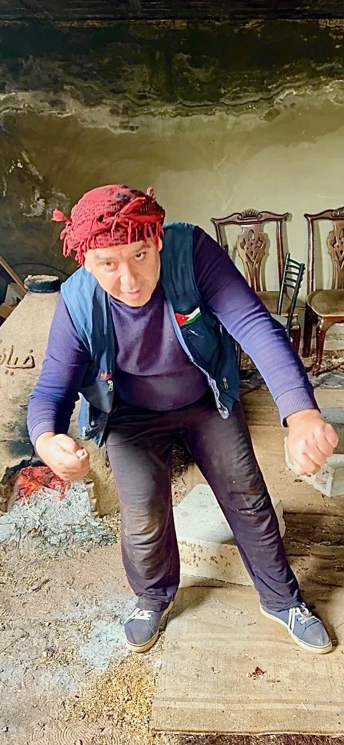 Hamza, gesturing as he sang. Sickle in one hand, wheat in the other. 