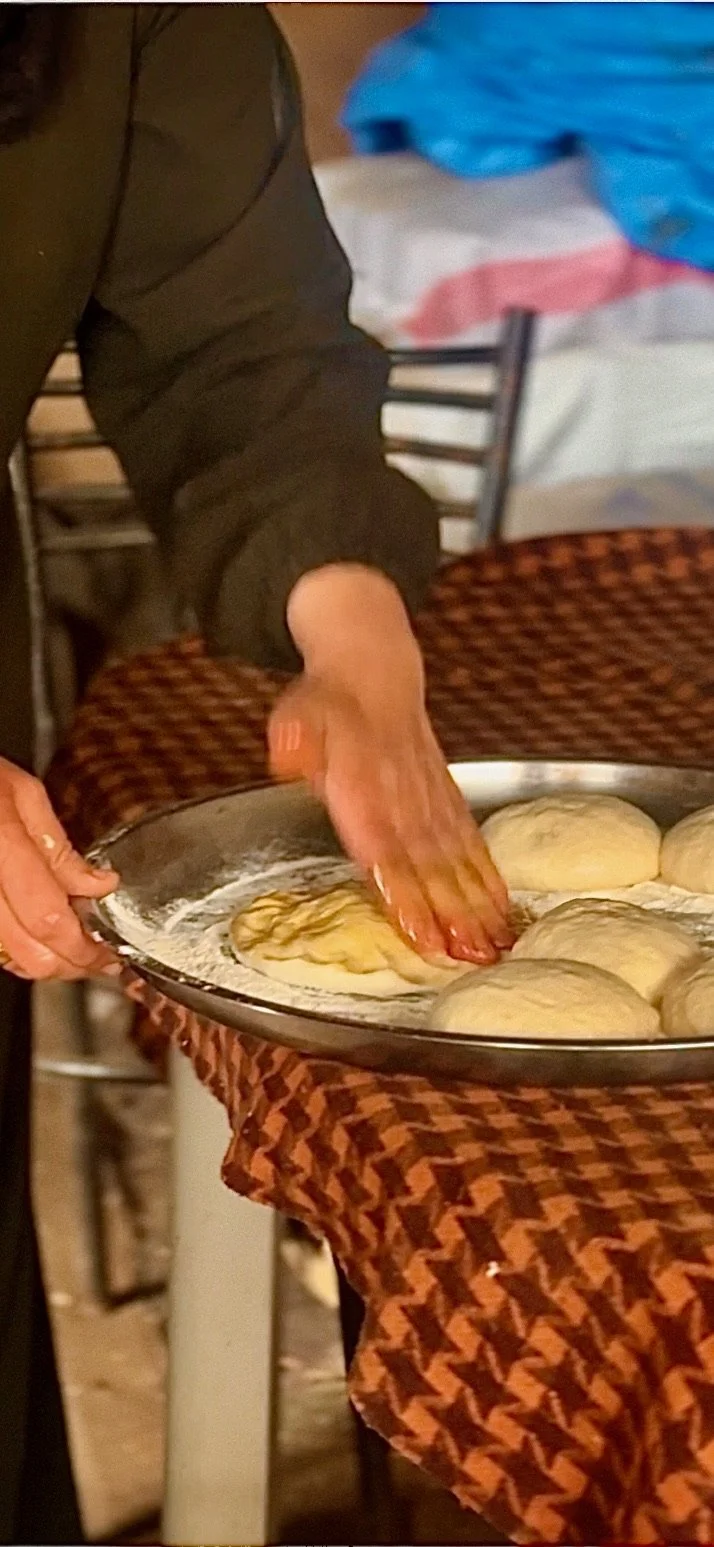 As we shaped the dough, pressing our fingers into its surface, I found myself noticing the imprint of her hands left behind. It felt almost like a blessing—this is how one touches dough to promote its life-giving essence.  