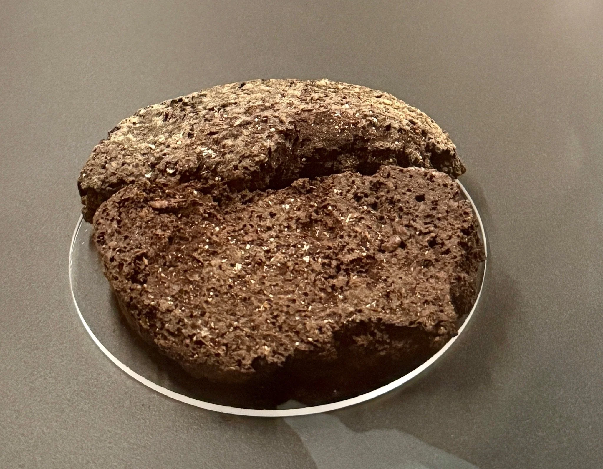 One ancient loaf, described by Howard Carter, the British archeologist who discovered King Tut’s tomb, as resembling a 'petrified sponge,' still holds the imprint of a baker's hand. You can almost picture the moment.