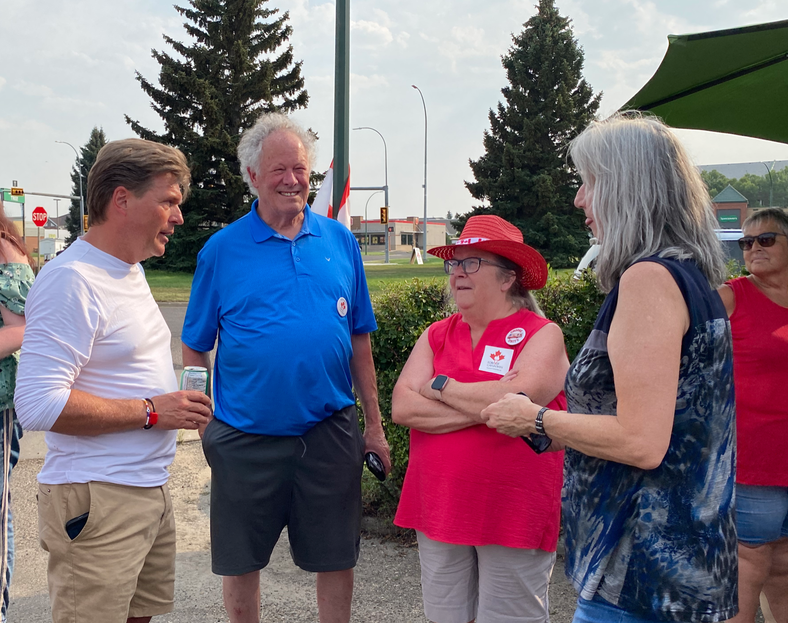  Lucaszuk (white shirt) speaking with local people 