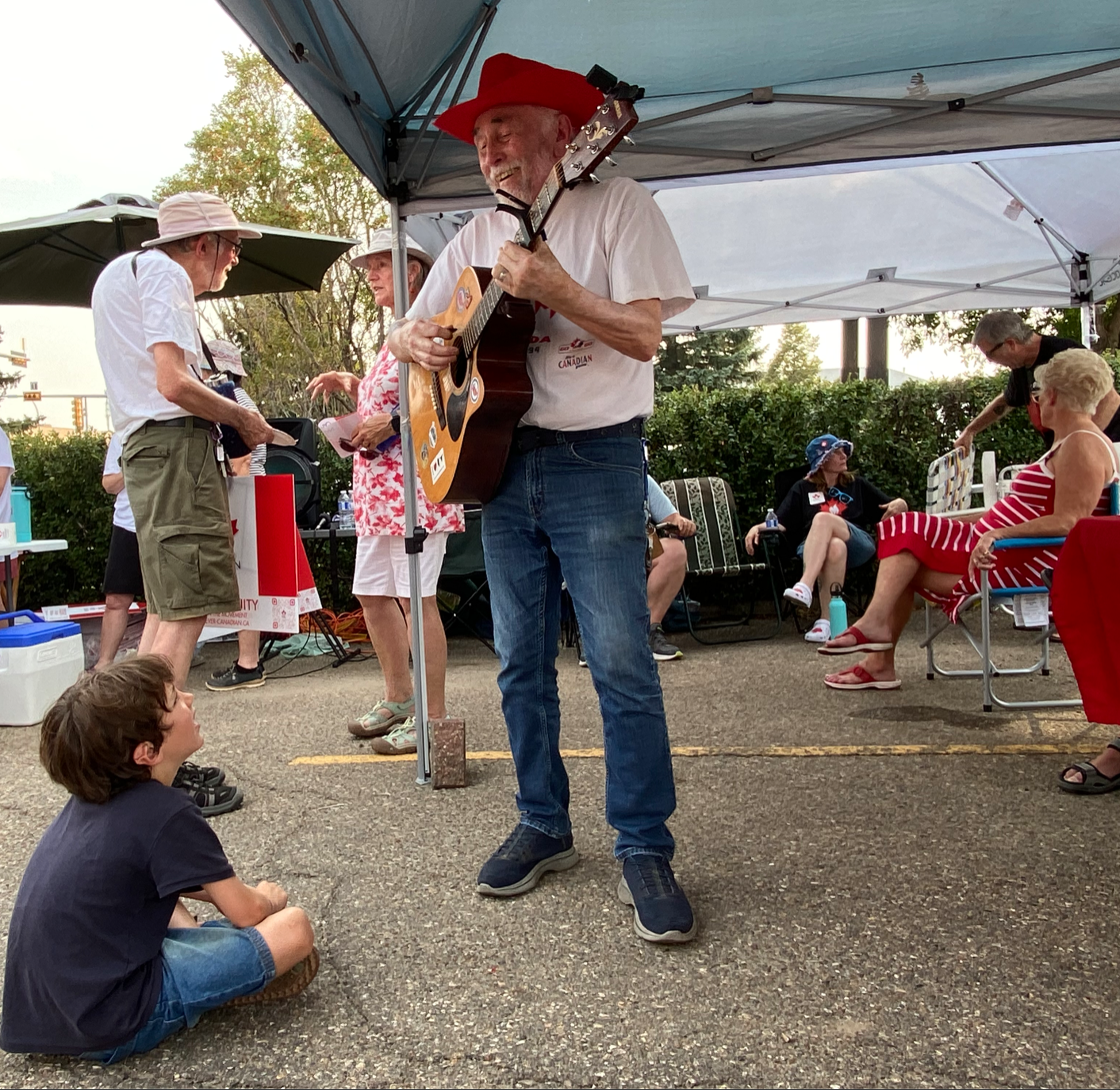 Wally Garrioch playing to a young fan