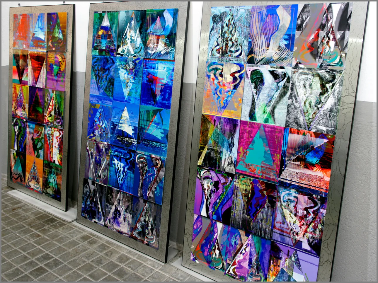 Mosaic panels made up of works from the Triangulation Series , from left to right: Earth , Water , and Chaos .