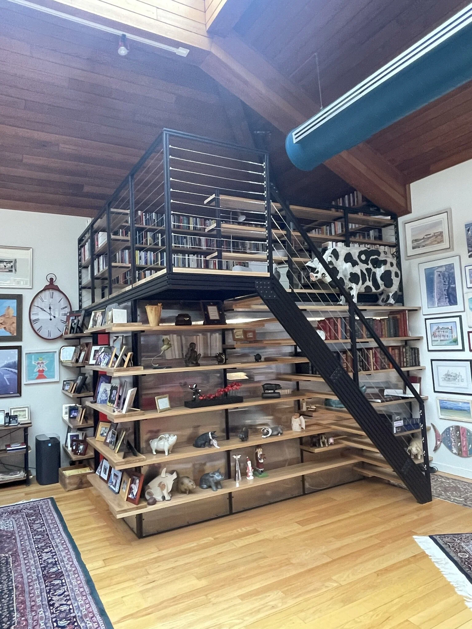  Industrial modern designed Library Loft complements the homeowners Industrial modern kitchen.  80/20 Aluminum Framing System,  white oak flooring from London Grove Cabinetmakers, polycarbonate twin walls from ePlastics and Dutch Door from Saner Mill