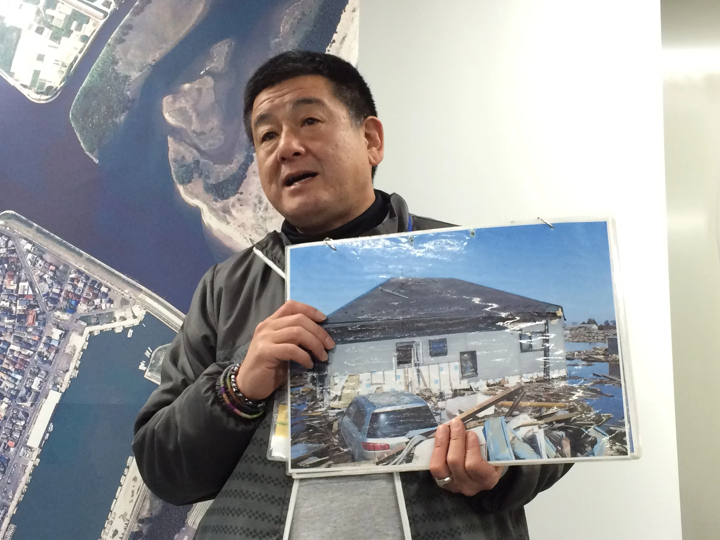 Figure 4: Nakamuna and a picture of his former house.