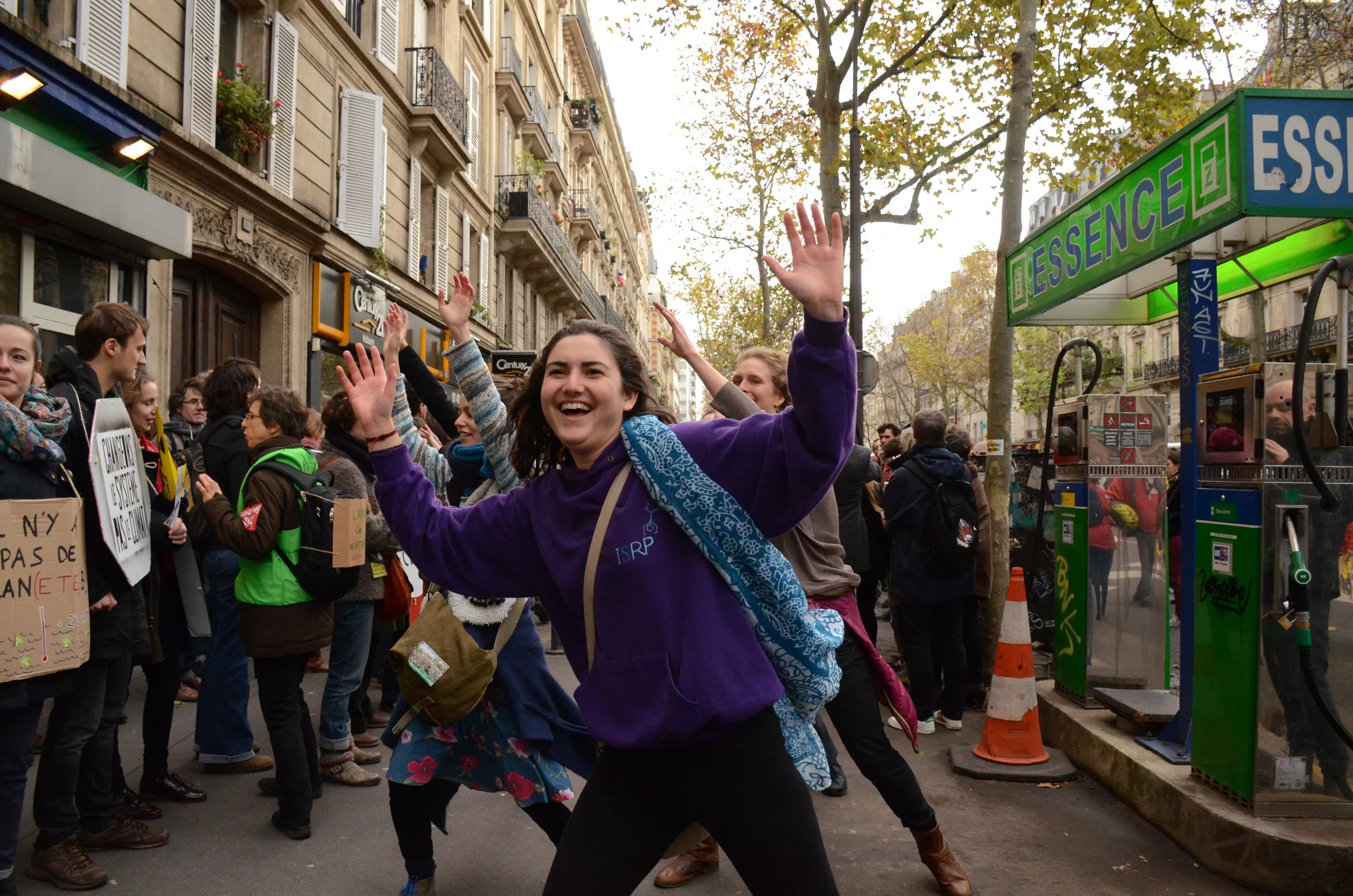 Activists dance on the streets of Paris near the human chain, despite the heavy police presence. 