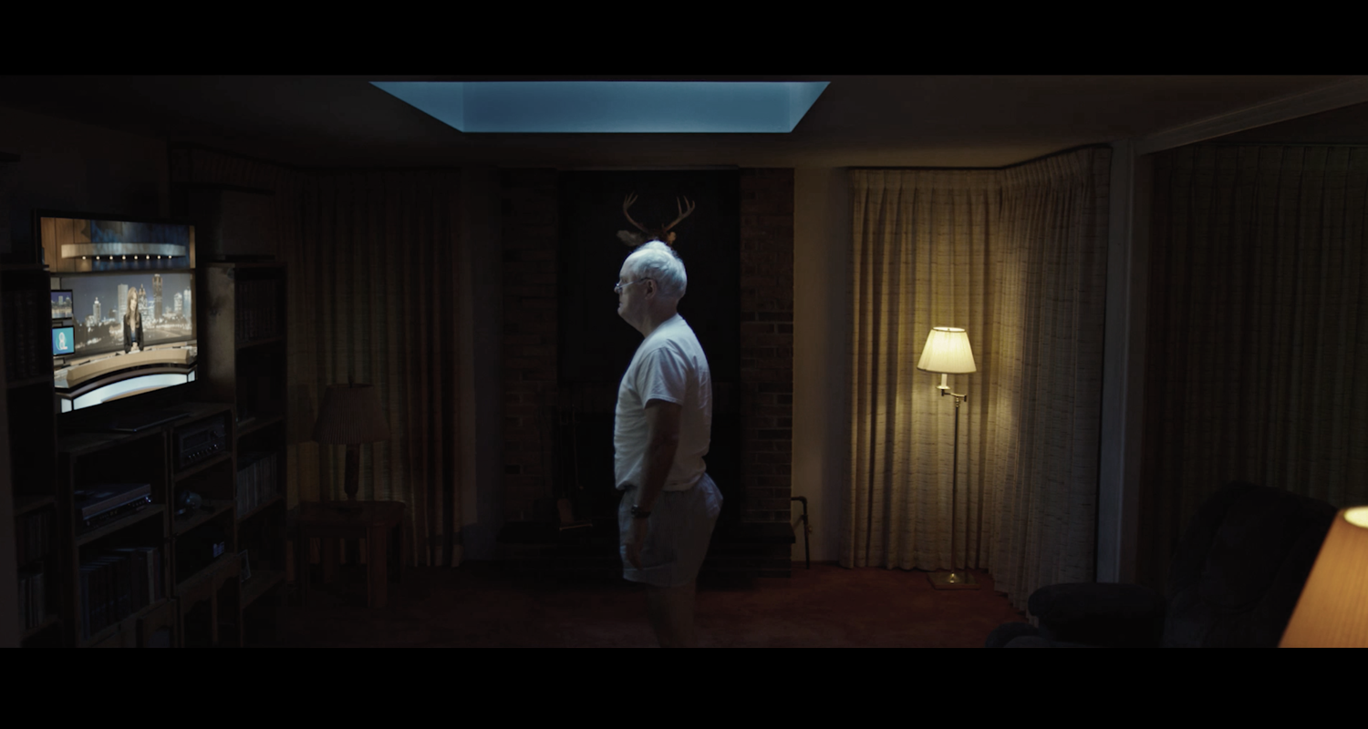 Ed standing at TV.png