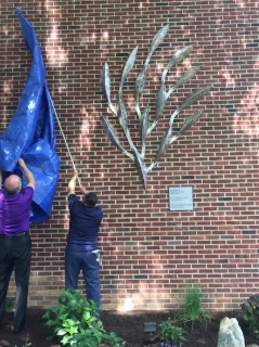 Removing the tarp from Sculpture Photo by Judi Benvenuti