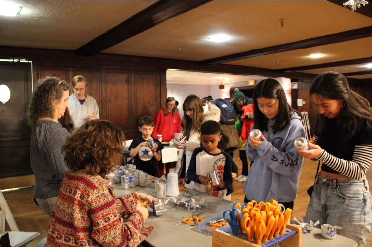 Students hard at work at the tree ornament table, including CHS teacher Kate Dodd and student volunteer Zoe Selesnick (furthest left).