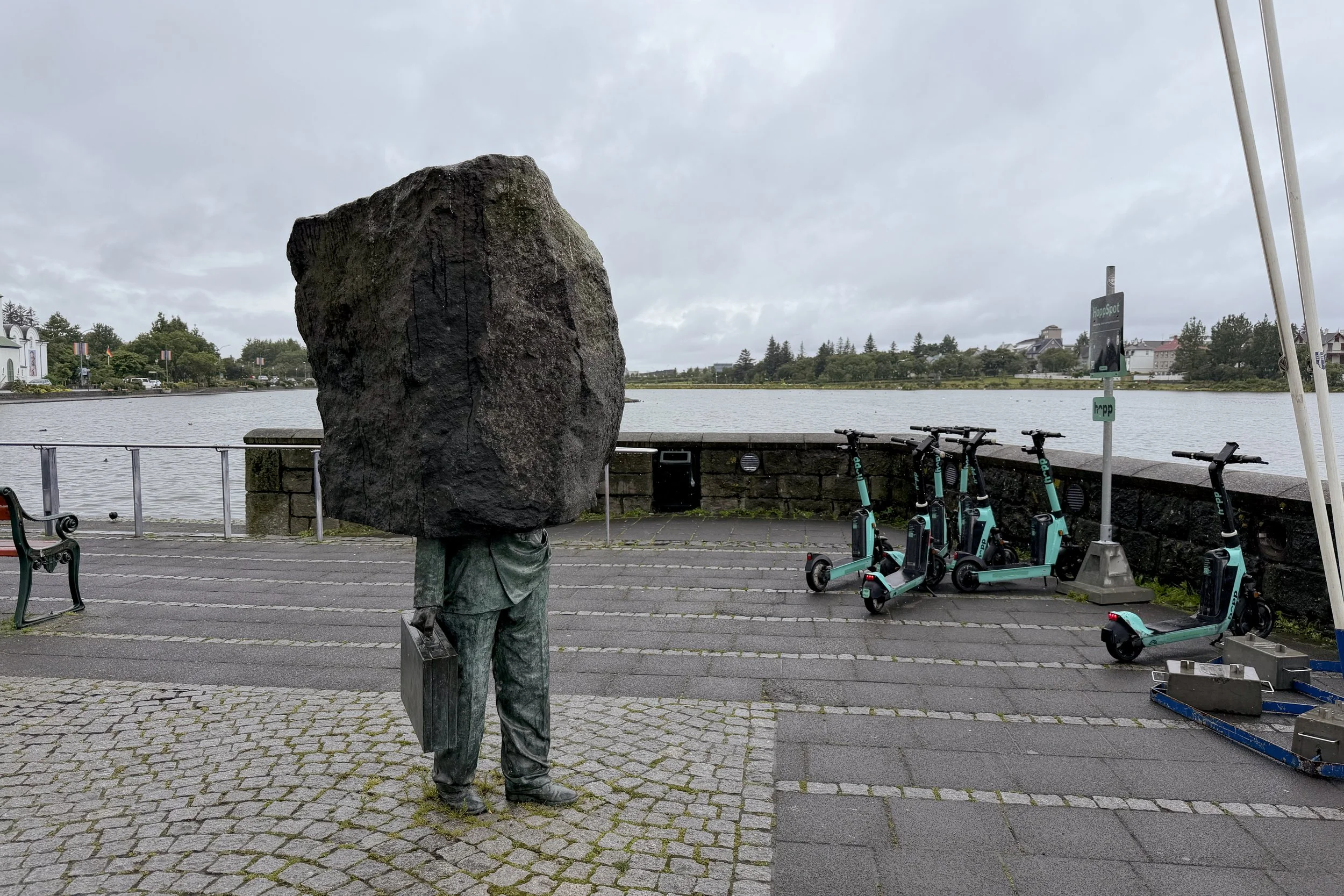 Statue of a faceless bureaucrat, The Pond