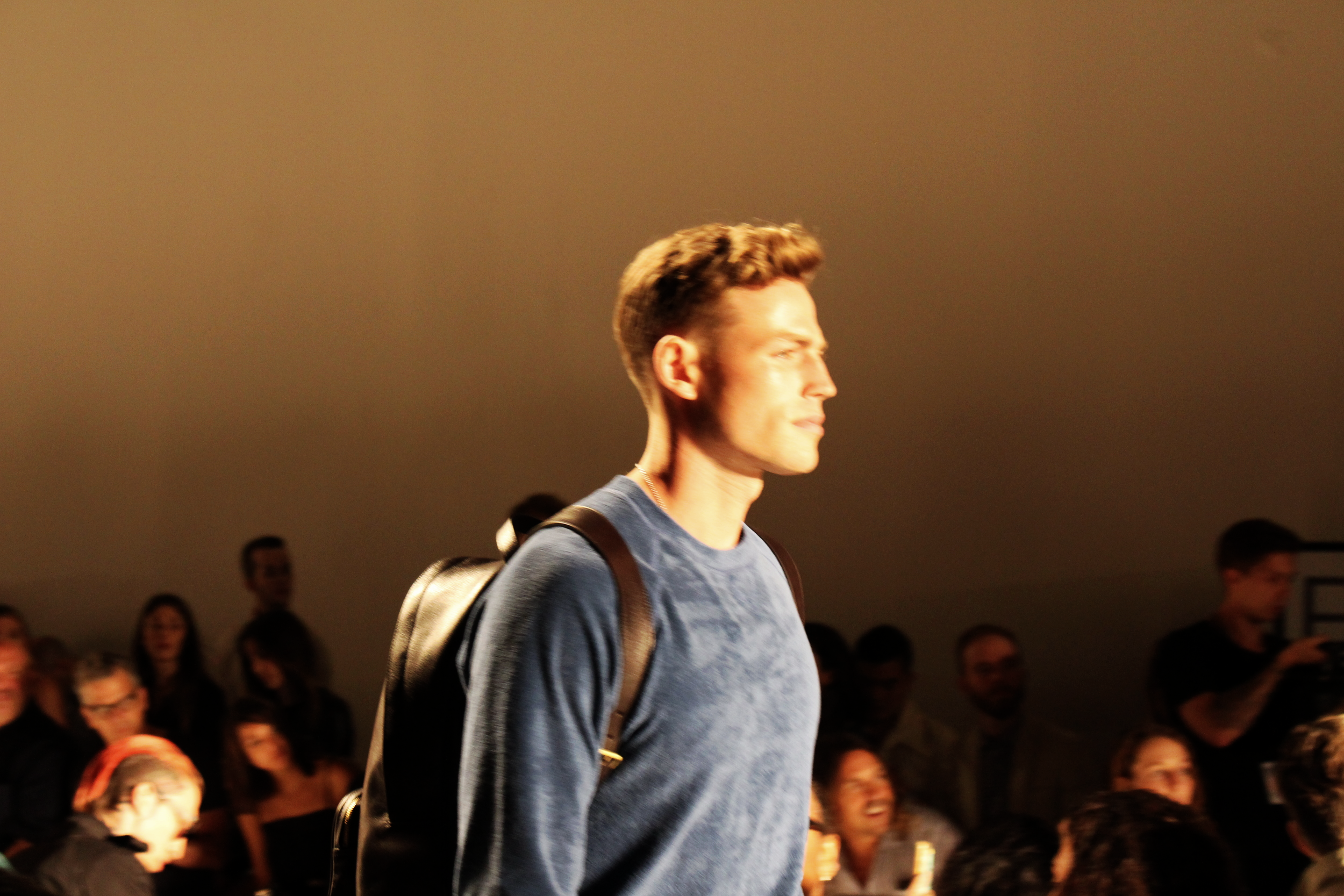 I'll take one of each: backpack, sweater, the man.