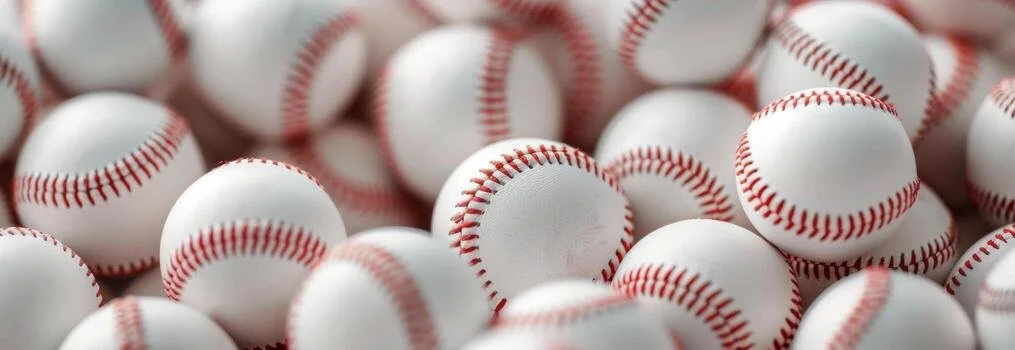 close-up-of-baseball-balls-in-a-pile-free-photo.jpeg