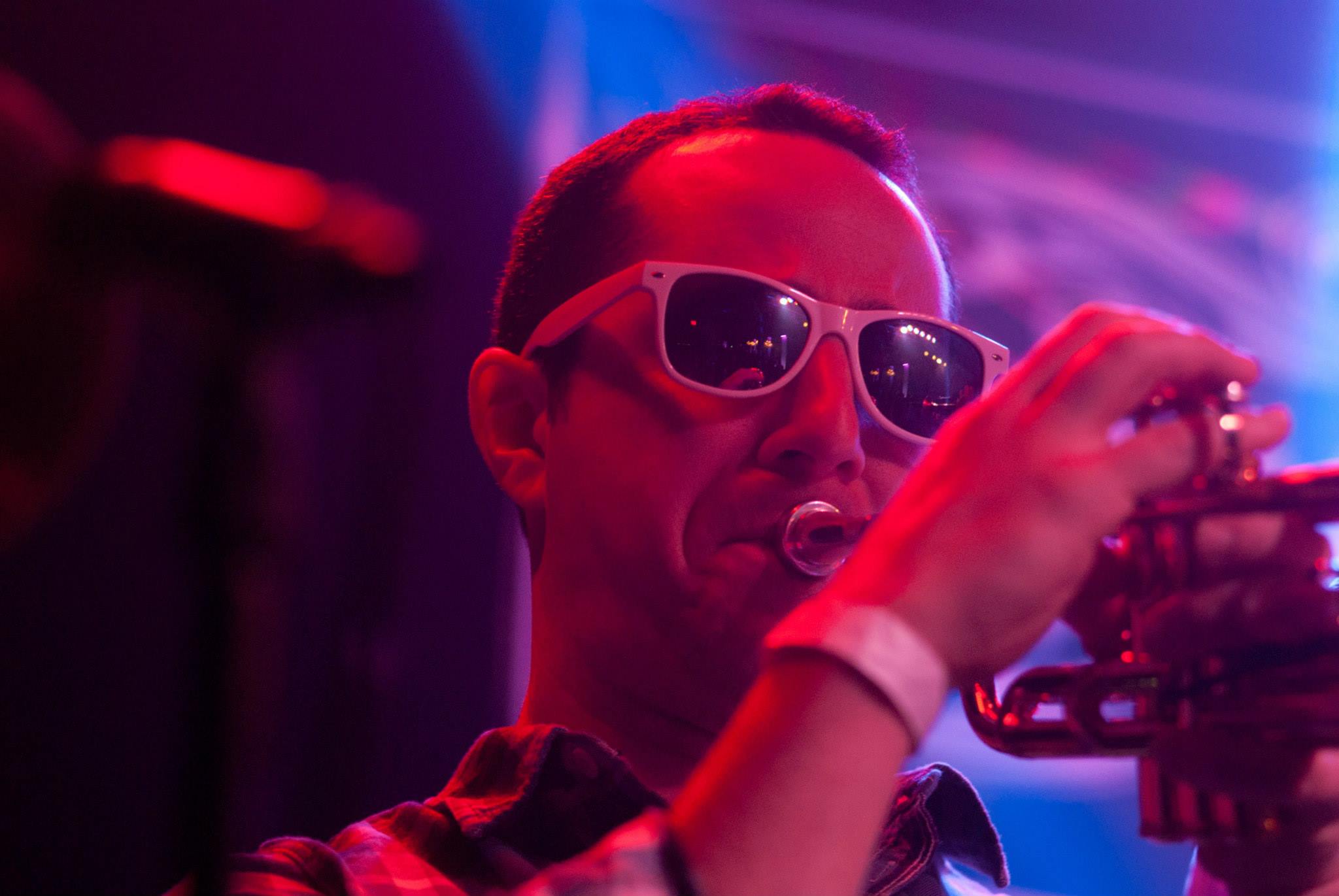 Taylor, a red devil playin’ trumpet