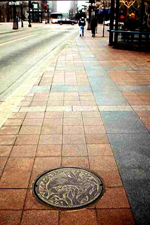© 2016 Kate Burke, installed Walleye manhole cover at Nicollet Mall in Minneapolis, Minnesota