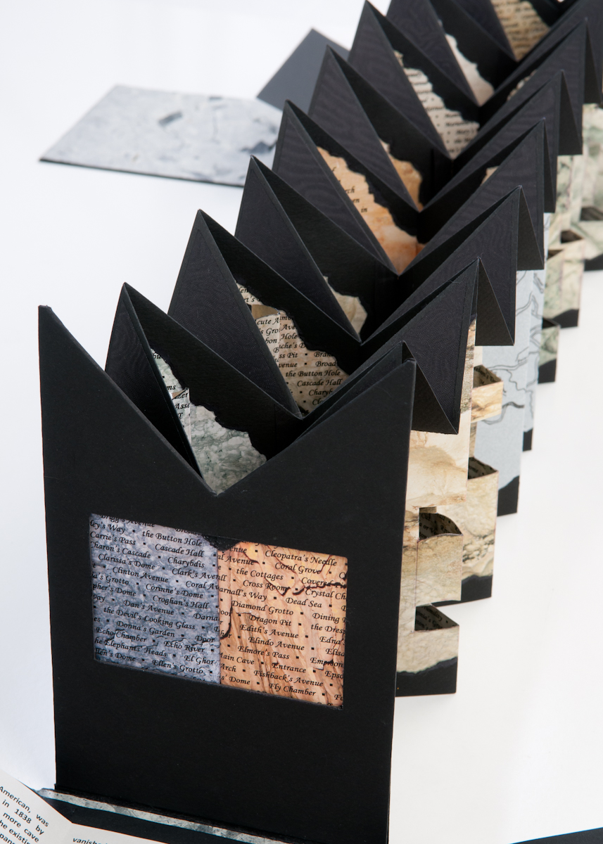 © 2011, photo by Tommy White; Depth Perception: Mapmaking Legacies at Mammoth Cave by Sharon Sharp, archival inkjet prints for text, map portions, and original photos; colored-pencil highlights on photos; Irish linen thread; binder’s board and magnets