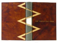 © 2010 Peter D Verheyen, Pamela Leutz, The Thread That Binds , Oak Knoll Press, 2010 Modified Bradel binding; red Roma endpapers; sewn link stitch on four reinforced leather tapes; dark red and gray handsewn endbands; spine covered in gray leather with cutouts for tapes; boards covered in reddish brown Pergamena deer vellum; title stamped in gold on front cover with leather onlays. 23 x 15.5 x 4 cm