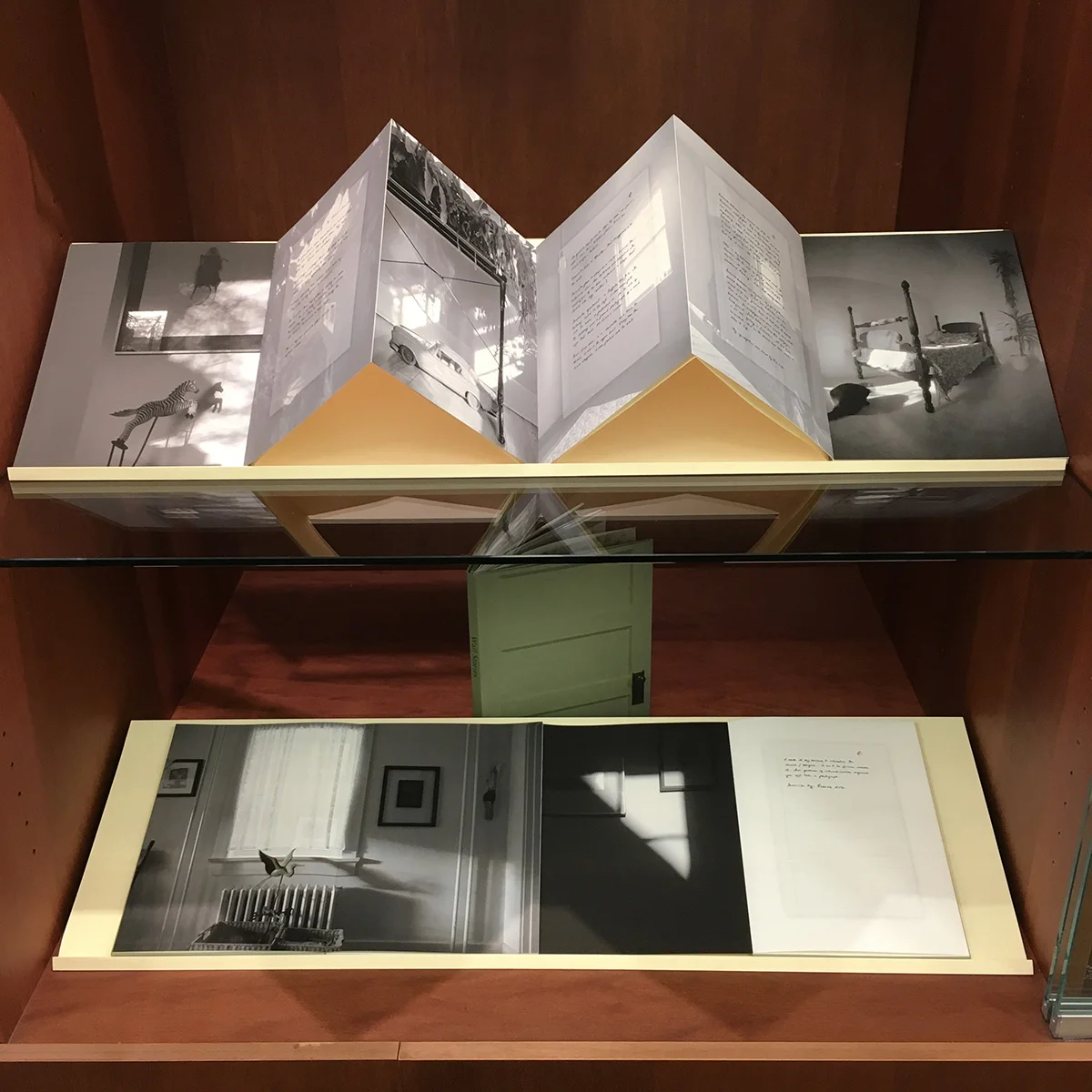 © 2014 M. MacCallum, Wall Stories, (text by Jessica Grant), hand-bound accordion book work, view of installation at The Unfolding Narrative at the Parrott Art Gallery in Belleville, Ontario